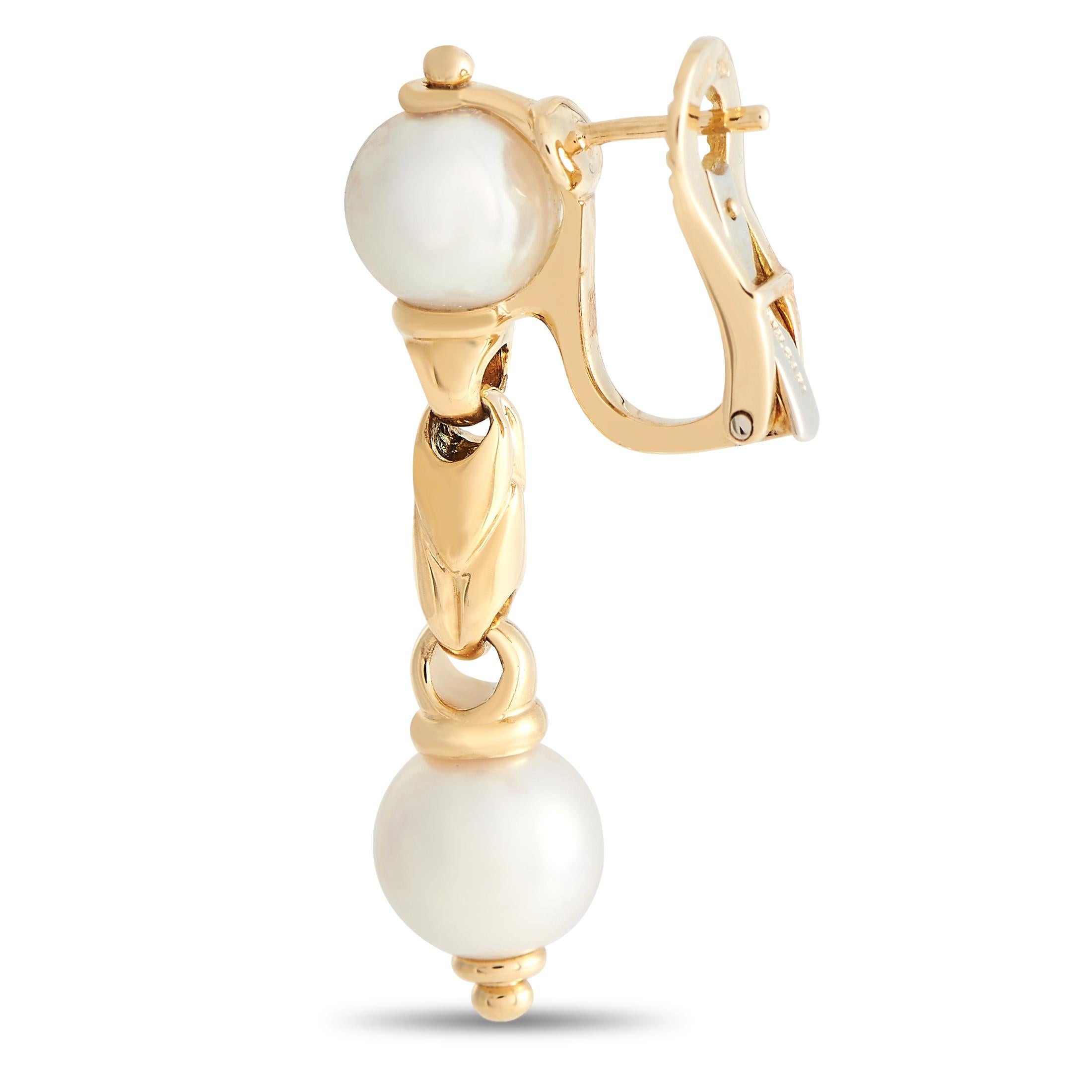 A sleek 18K Yellow Gold setting is elevated by opulent Pearl accents on these impressive Bvlgari Passo Doppio earrings. Chic and incredibly elegant, each one measures 1.5” long and 0.31” wide. 
 
 This jewelry piece is offered in estate condition