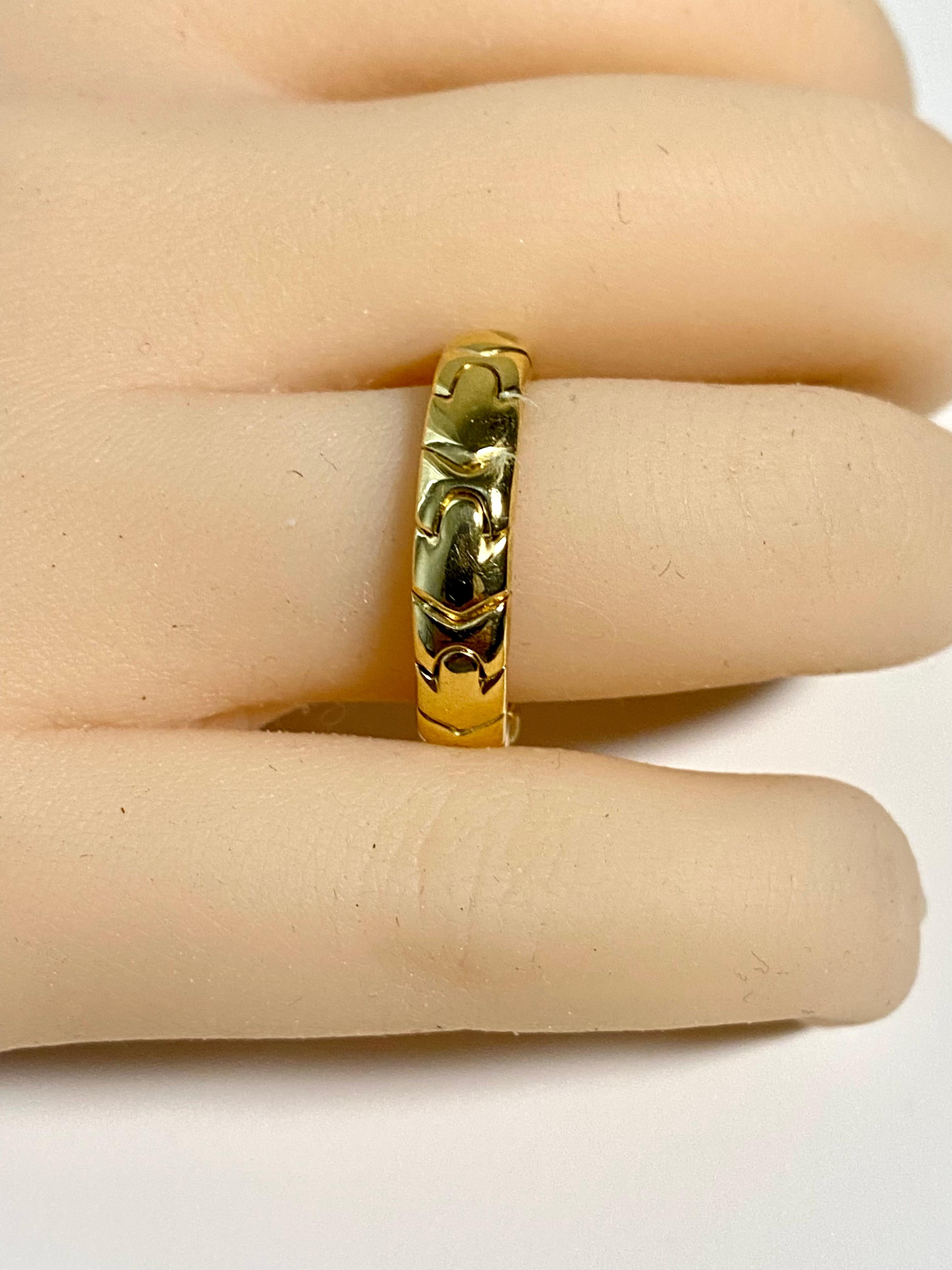 Vintage Bvlgari, from the Passo Doppio Collection, 18 karat yellow Gold band
Ring is 5.2 mm wide, 0.22 inch
Ring finger size 9
Ring marked Bvlgari, 750, made in Italy, Italian mark.
Open cuff design 
Ring weighing 9.5 grams
The Bvlgari Passo Doppio