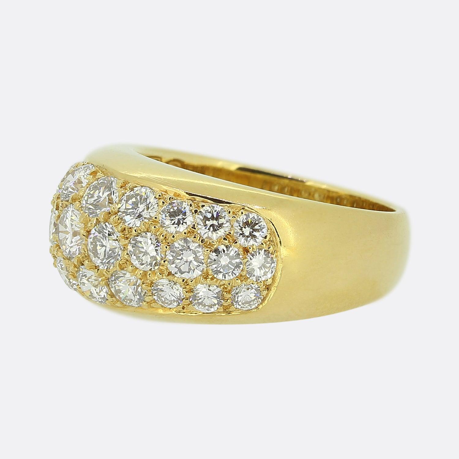 Here we have an excellently crafted diamond ring from the world renowned luxury Italian jewellery designer, Bvlgari. A rich 18ct yellow gold mount plays host to a scintillating pavé diamond set face. Each round brilliant cut stone has been