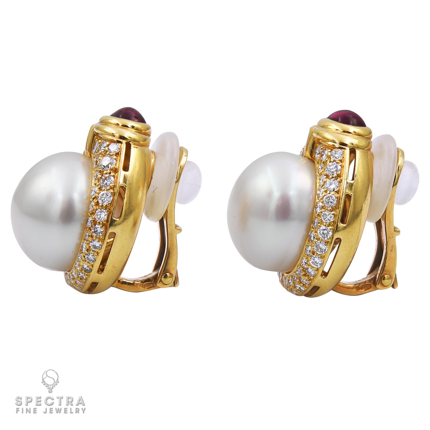 A beautiful pair of ear clips made by Bvlgari.
Each ear clip features a pearl center accented by diamonds with a cabochon ruby on top. 
Diamonds are approximately G color, VS clarity.
Each ear clip measures 0.6x0.8 inches.
Signed Bvlgari.
Stamped