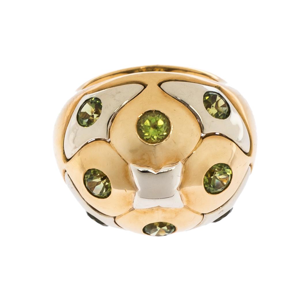 It is definitely love at first sight with this Bvlgari cocktail ring. Beautifully crafted from 18k yellow gold, it comes designed in a dome shape. The head of the ring flaunts an assembly of peridots stationed over 18k white gold panels. Picture