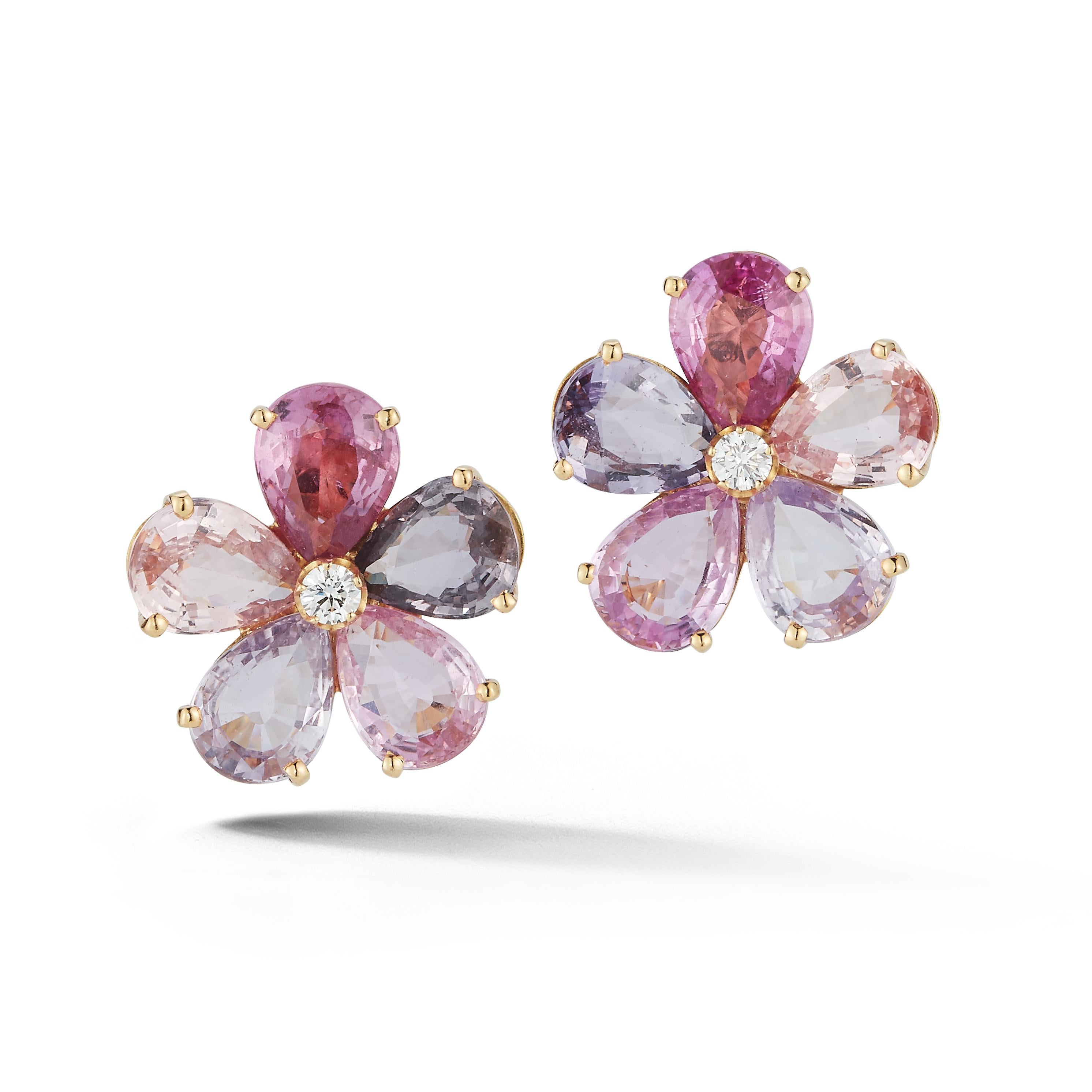 Bulgari Pink Sapphire & Diamond Flower Earrings

 5 pear shape pink and purple sapphires surrounding  1 round cut diamond set in 18k yellow gold.

Back Type: Clip On

Signed,  Bvlgari 

Measurements: .60