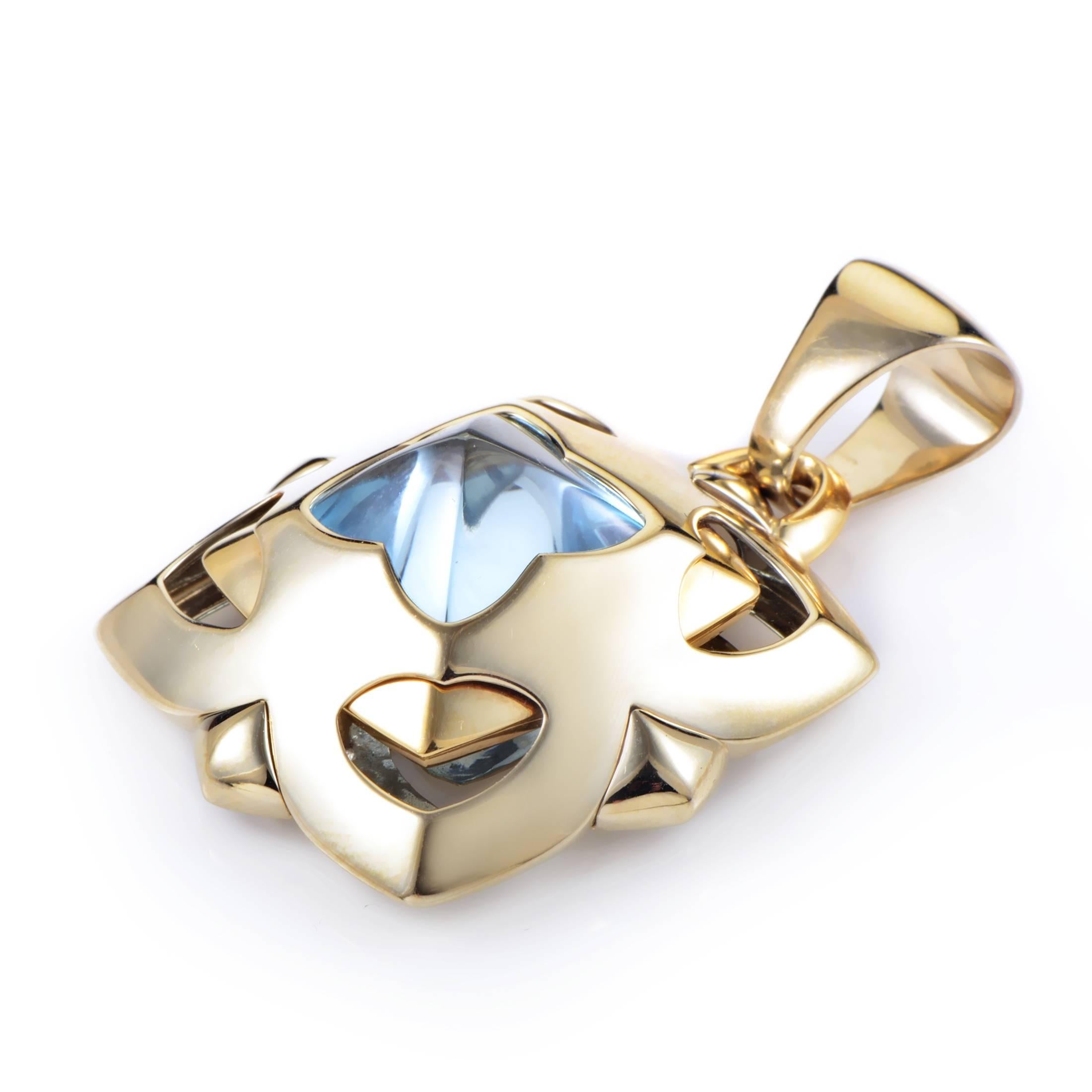 This enhancer pendant from Bvlgari's Piramide collection is truly eye-catching. The pendant is made of both 18K yellow and white gold and features a brilliant blue topaz stone.