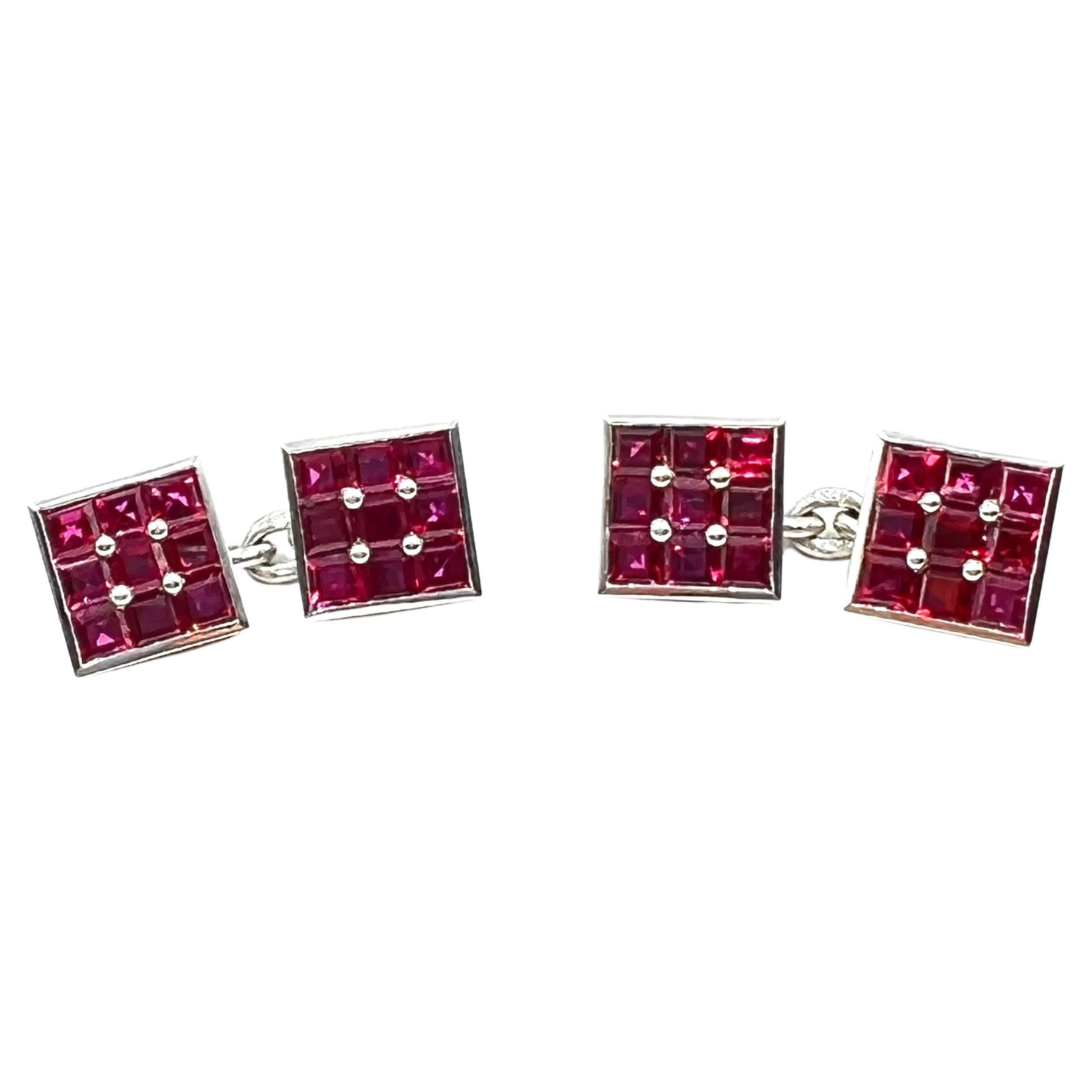 Bvlgari platinum square form French cuff style cufflinks.  Square form design, each calibre set with nine square, step cut, natural rubies measuring approximately 2.5mm each. 36 rubies weighing approximately 4.00 total carats. Signed 