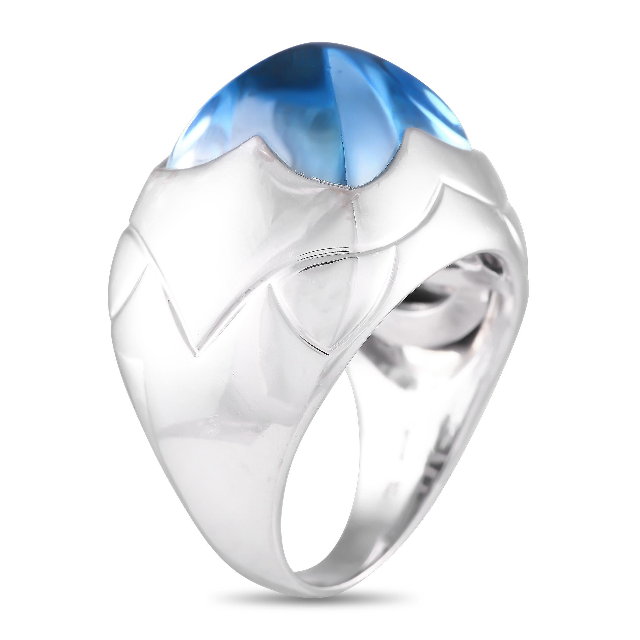 Here is a piece of statement jewelry you can wear to articulate your style. This Bvlgari ring is fashioned in 18K white gold and is detailed with a sugarloaf cabochon. A high-domed, four-sided sky-blue topaz sits like a pyramid atop this cocktail