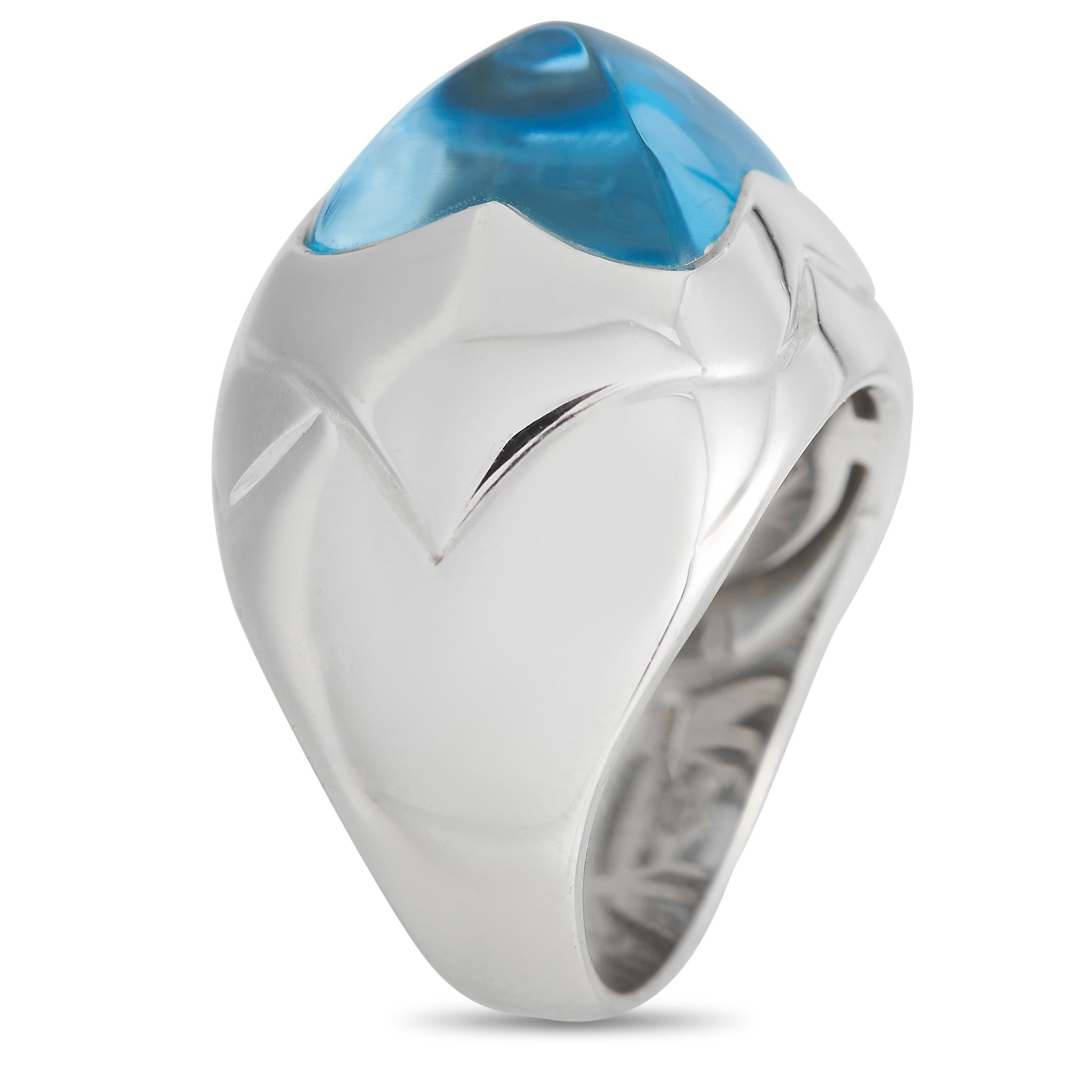 Instantly add a sense of individuality to your style with this Bvlgari ring. It features a 5mm-thick band in 18K white gold topped with a sugarloaf cut topaz that displays a pyramid's conical silhouette. The sky blue gem has no facets and features a