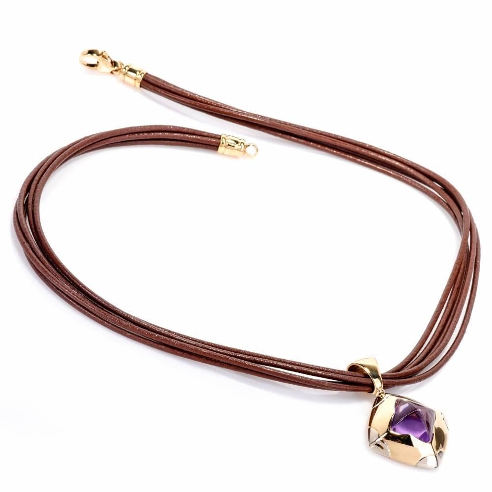 This captivating Bvlgari pendant necklace of alluring aesthetic  consists of a sculptural square shape pendant crafted in solid 18 karat yellow gold, exposing a breath-taking pyramidal faceted amethyst, weighing 10.00 carats, mounted within a