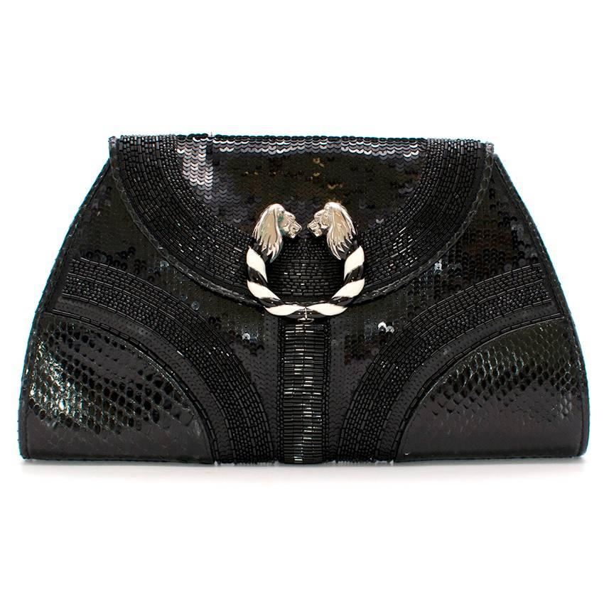 Bulgari Bead Embellished Clutch Bag 

-Shiny black python skin
-Black nappa leather lining
-Iconic lion head as front closure 
-Black and white enamel detailing at front 
-Seed beads embellishment 

Depth:15cm 
Height:19cm 
Length:28cm

Please note,