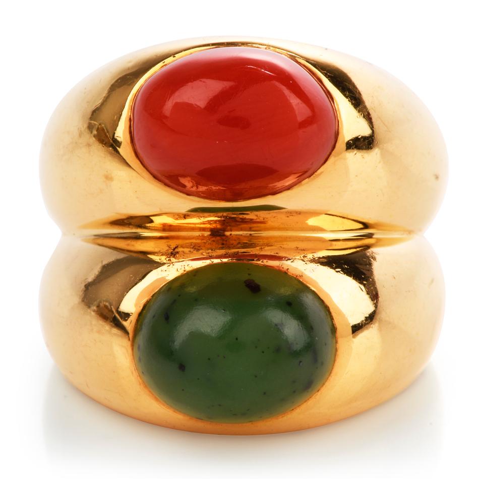 This fashionable late late 1980’s Bulgari wide ring is crafted in solid 18-karat yellow gold, weighing 22 grams and measuring 19mm x 9mm high. Exposed with one bezel-set natural red oval-shaped cabochon weighing approximately, 2.50 carats and one