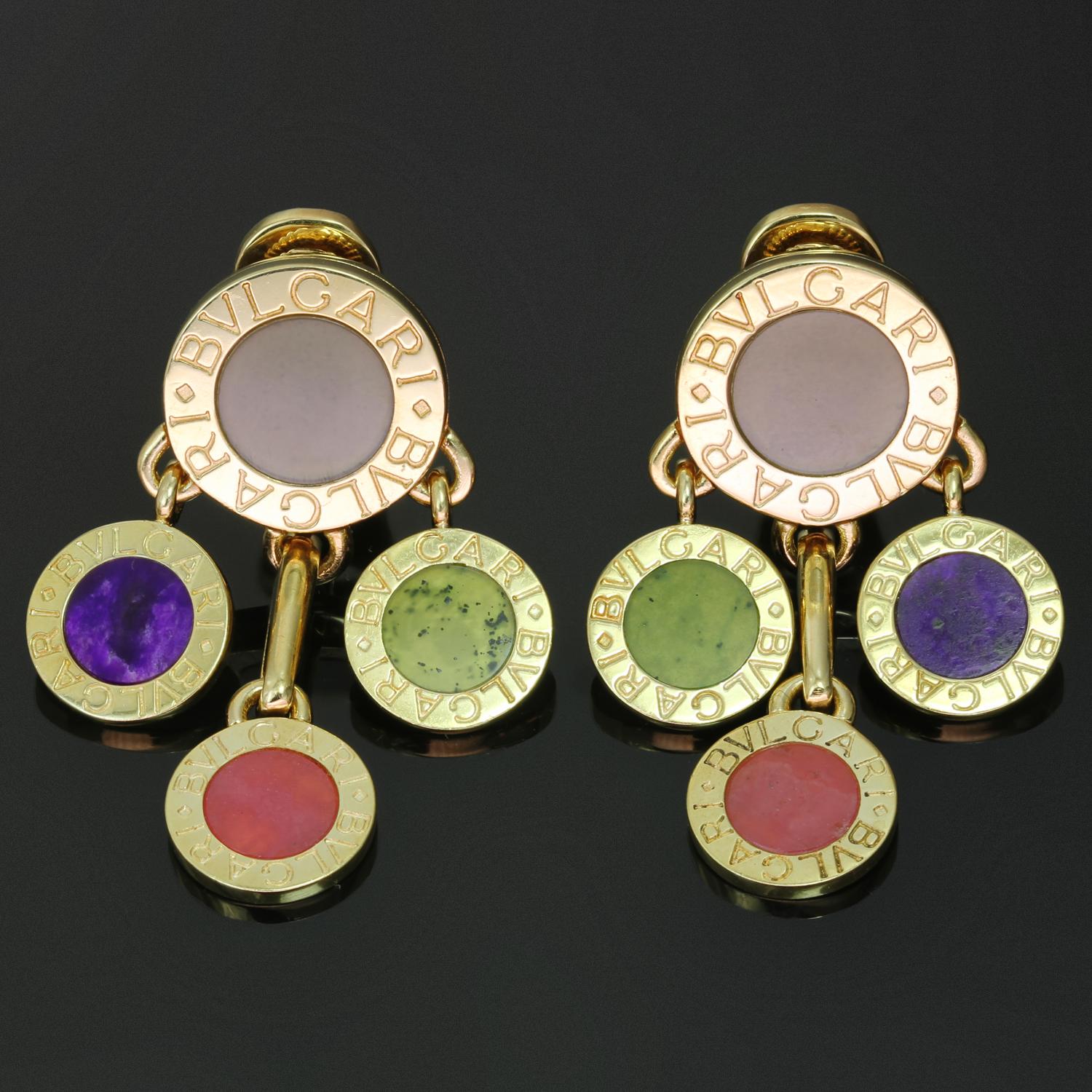 These fabulous Bvlgari clip-on earrings are crafted in 18k yellow gold and feature a drop design composed of Bvlgari-engraved circular elements set with green jade and multicolored rhodochoriste. Made in Italy circa 2000s. Measurements: 0.98