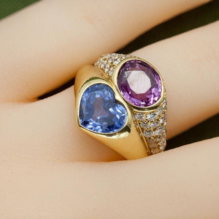 Bvlgari ring in 18-karat yellow gold with diamonds (.75 ct), blue sapphire (2.73 ct), and pink sapphire (2.40 ct). US size 5.5.

Hallmarks: Bvlgari, 750, Made in Italy, and serial number.

Weight: 12.80 gm

Measurements provided are for the
