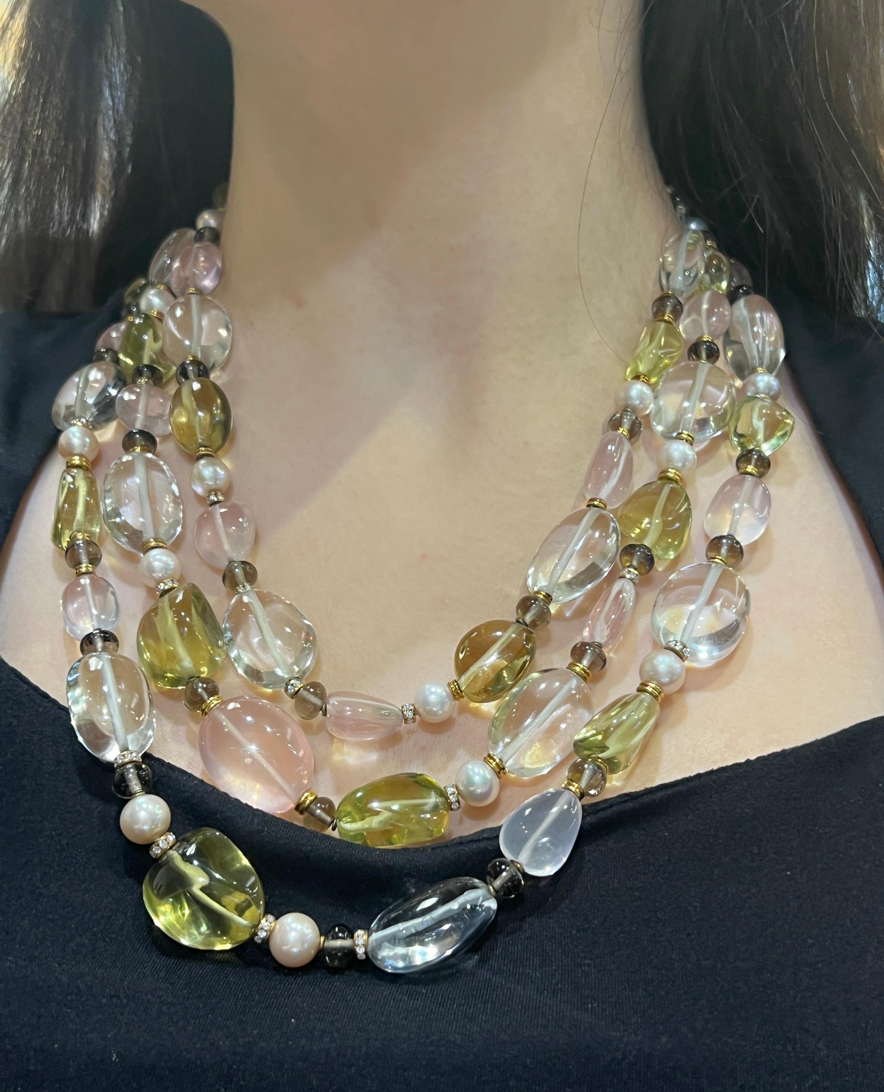 Bvlgari Rock Crystal Rose Quartz and Peridot Bead Necklace

A Bvlgari necklace with three rows of polished pebble-shaped rock crystal, rose quartz, and peridot gems, alternating with cultured pearls and gold and diamond rings.
  
Signed: