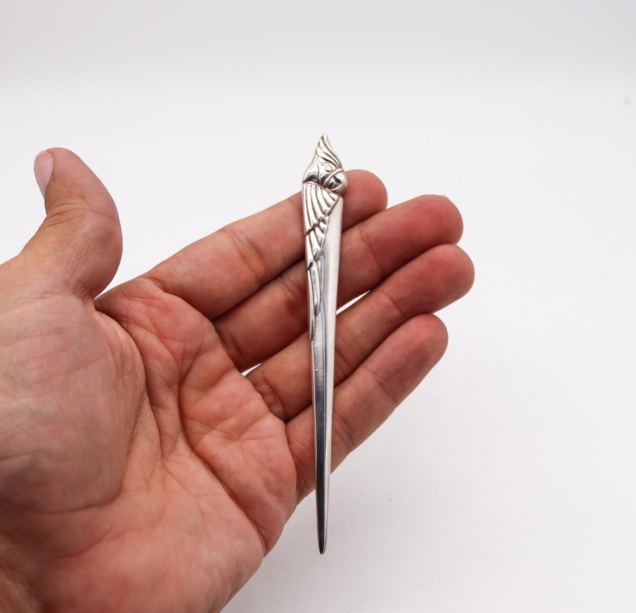 Letter opener designed by Bvlgari.

Vintage desk piece, created in Rome Italy by the luxury house of Bvlgari, back in the 1970's. This very decorative letter cutter opener have been crafted with the stylized shape of a parrot bird in solid