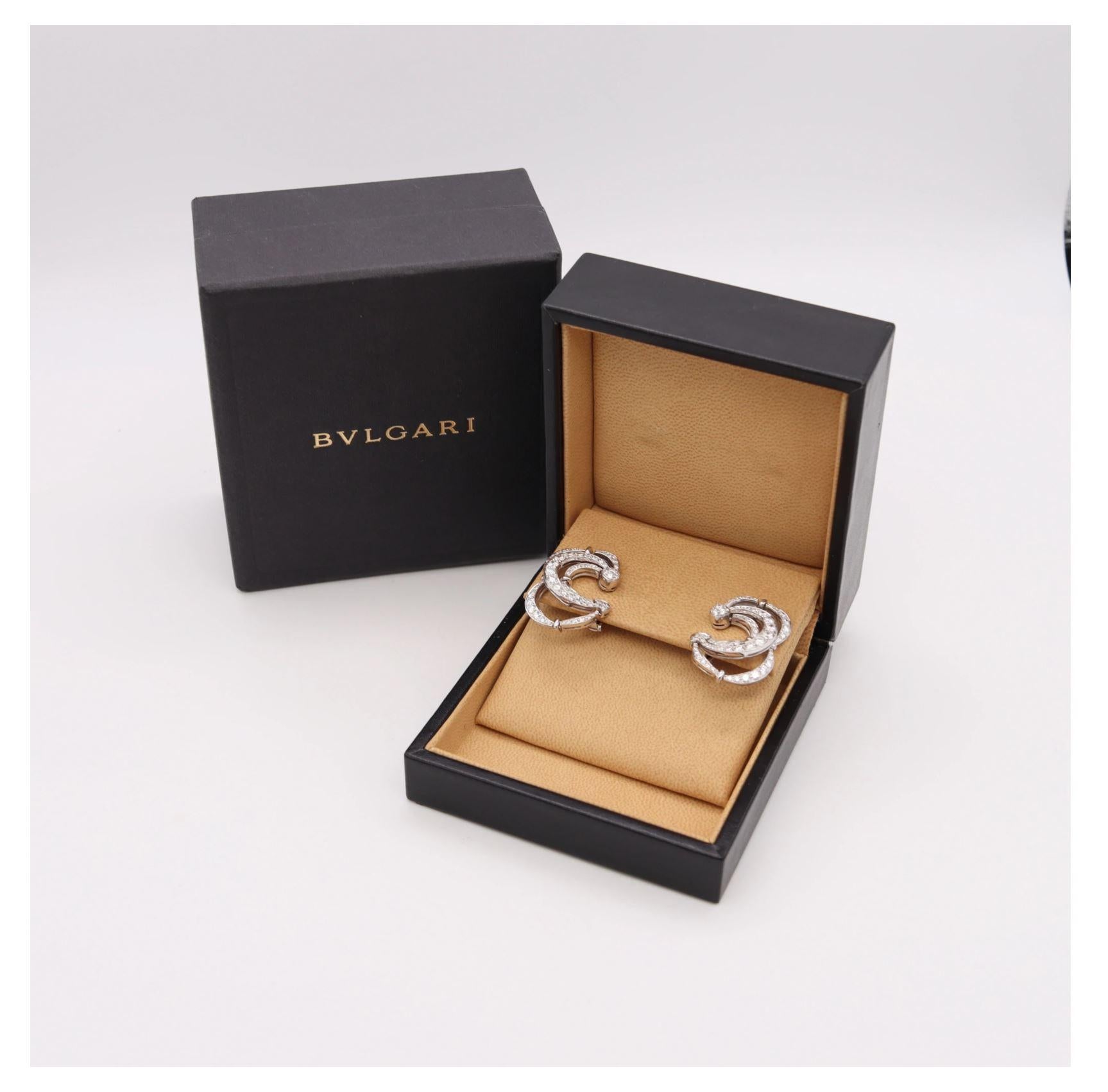 Pair of diamonds cluster Earrings designed by Bvlgari.

Fabulous pair, created in Rome Italy by the iconic jewelry house of Bvlgari. These great gem-set cluster pair of clips-earrings are from the exclusive Bvlgari collection privee and was