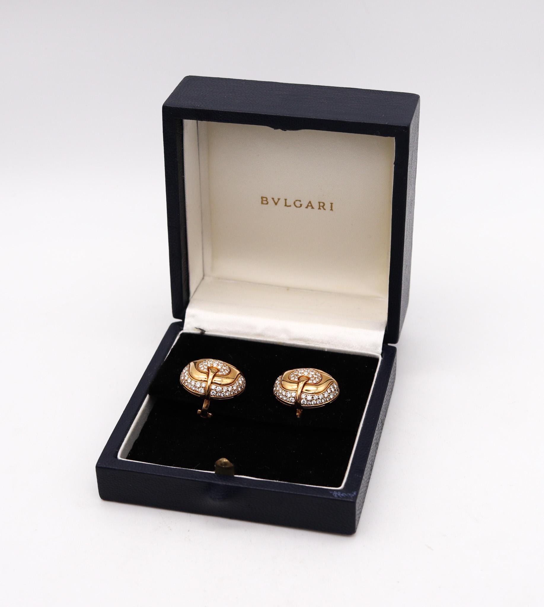 Pair of diamonds Earrings designed by Bvlgari.

Beautiful pair of contemporary earrings, created in Rome Italy by the iconic jewelry house of Bvlgari. These great pair of clips-on earrings has been carefully crafted as a left and right with a bombe