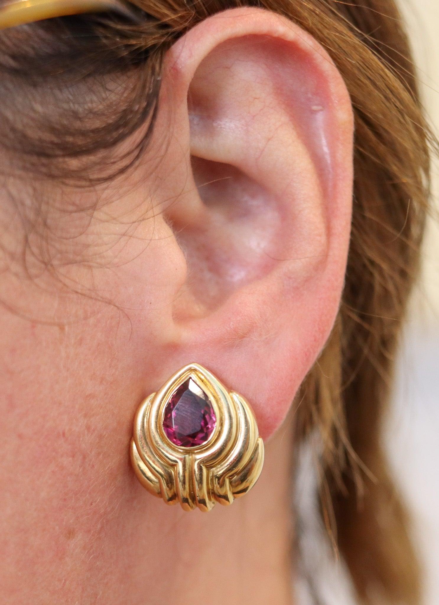 Gem set earring designed by Bvlgari.

Stupendous pair of clips-on earrings, created in Roma Italy by the jewelry house of Bvlgari. This colorful pair has been crafted with classic stepped patterns in solid yellow gold of 18 karats with high polished