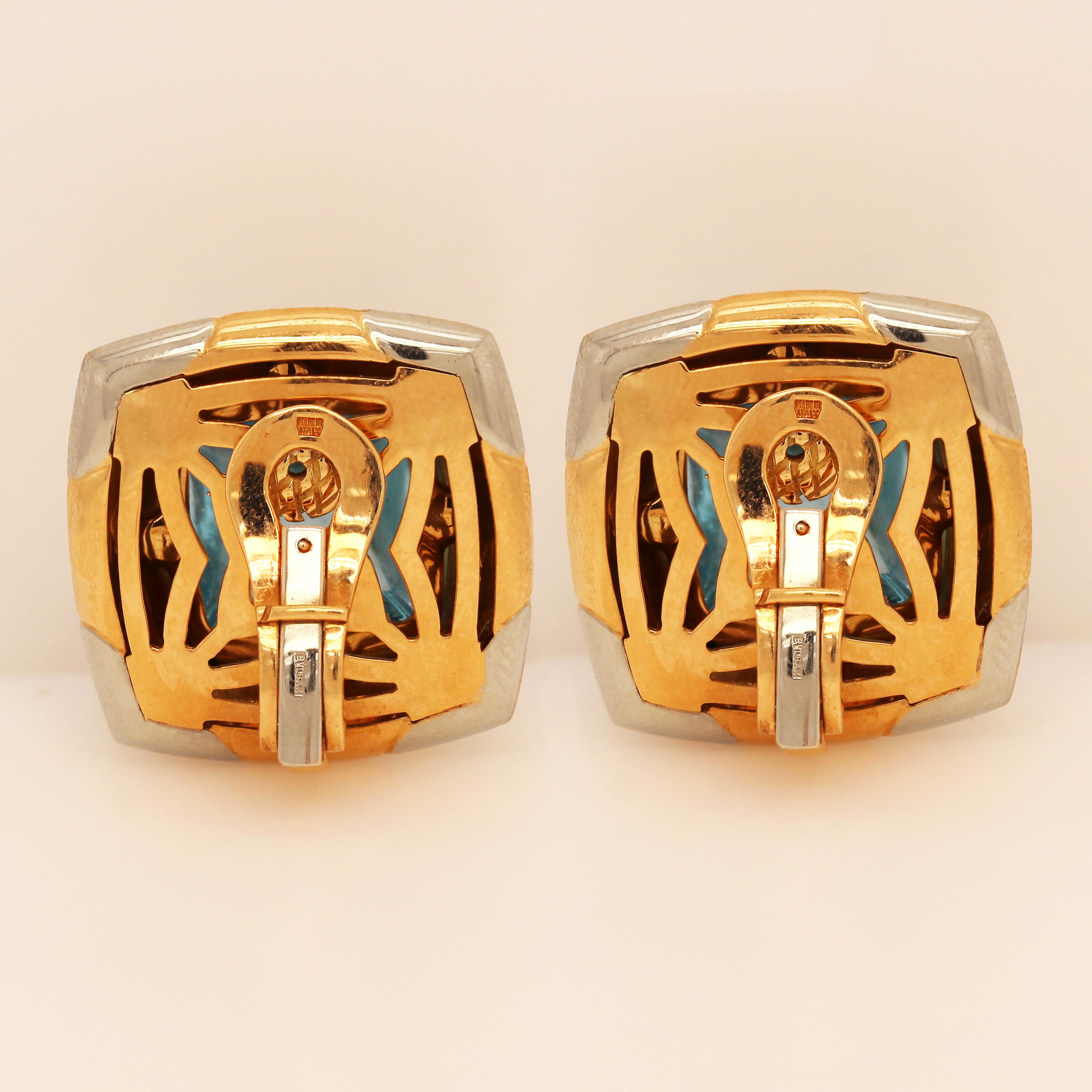 Bvlgari Roma Pyramid 18K Two Tone Gold Sugarloaf Cabochon Blue Topaz Clip On Earrings

Produced in Italy by the jewelry house of Bvlgari circa late 1990's. These earrings are from the Pyramid collection, crafted in solid 18k yellow and white gold