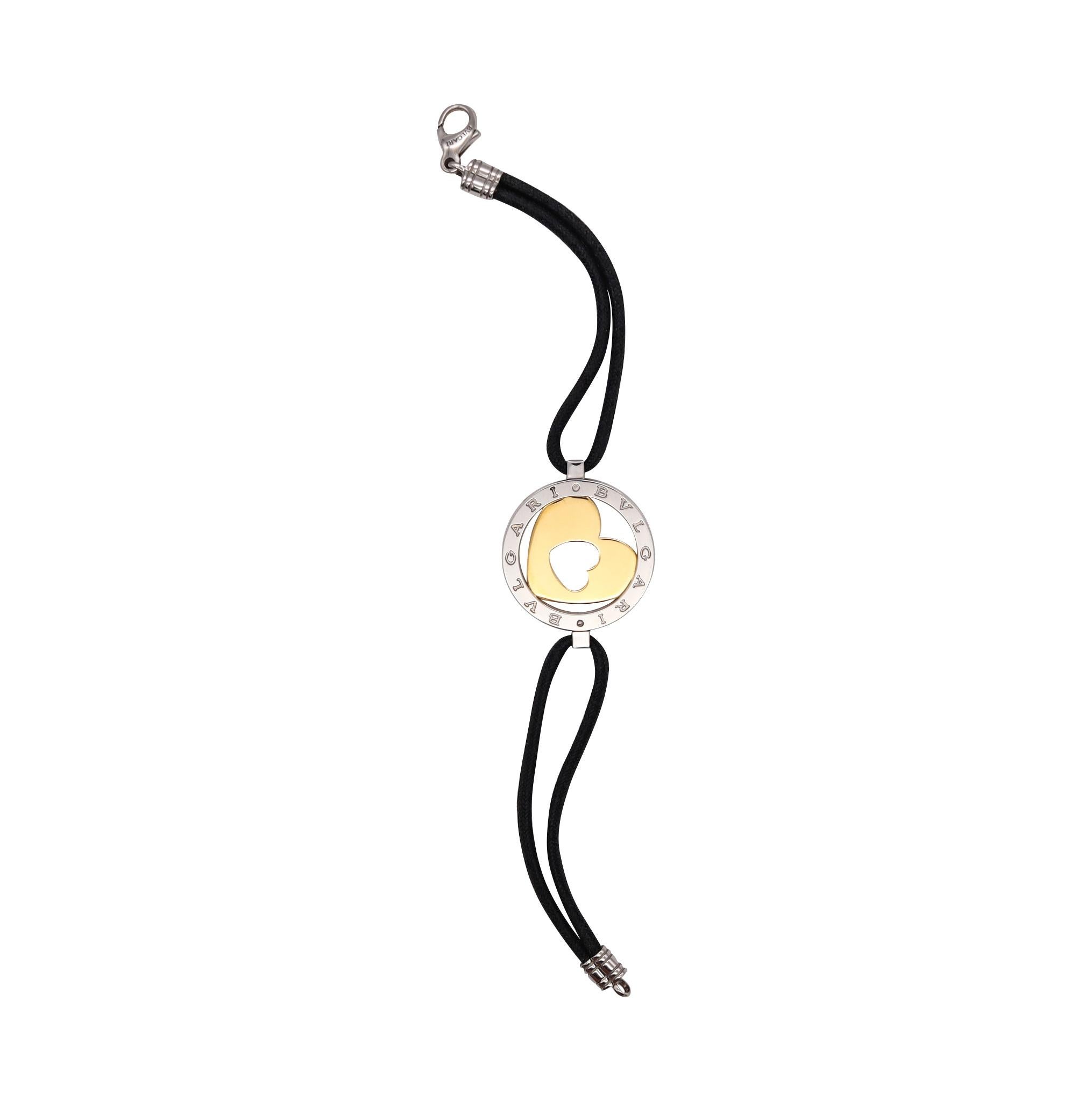 Tondo bracelet designed by Bvlgari.

Nice bracelet, crafted in Roma Italy by the house of Bvlgari in 18 karats yellow gold and stainless steel. Suited with a double straps silk cords and a security lobster lock.

Has a total weight of 9.92 Grams and