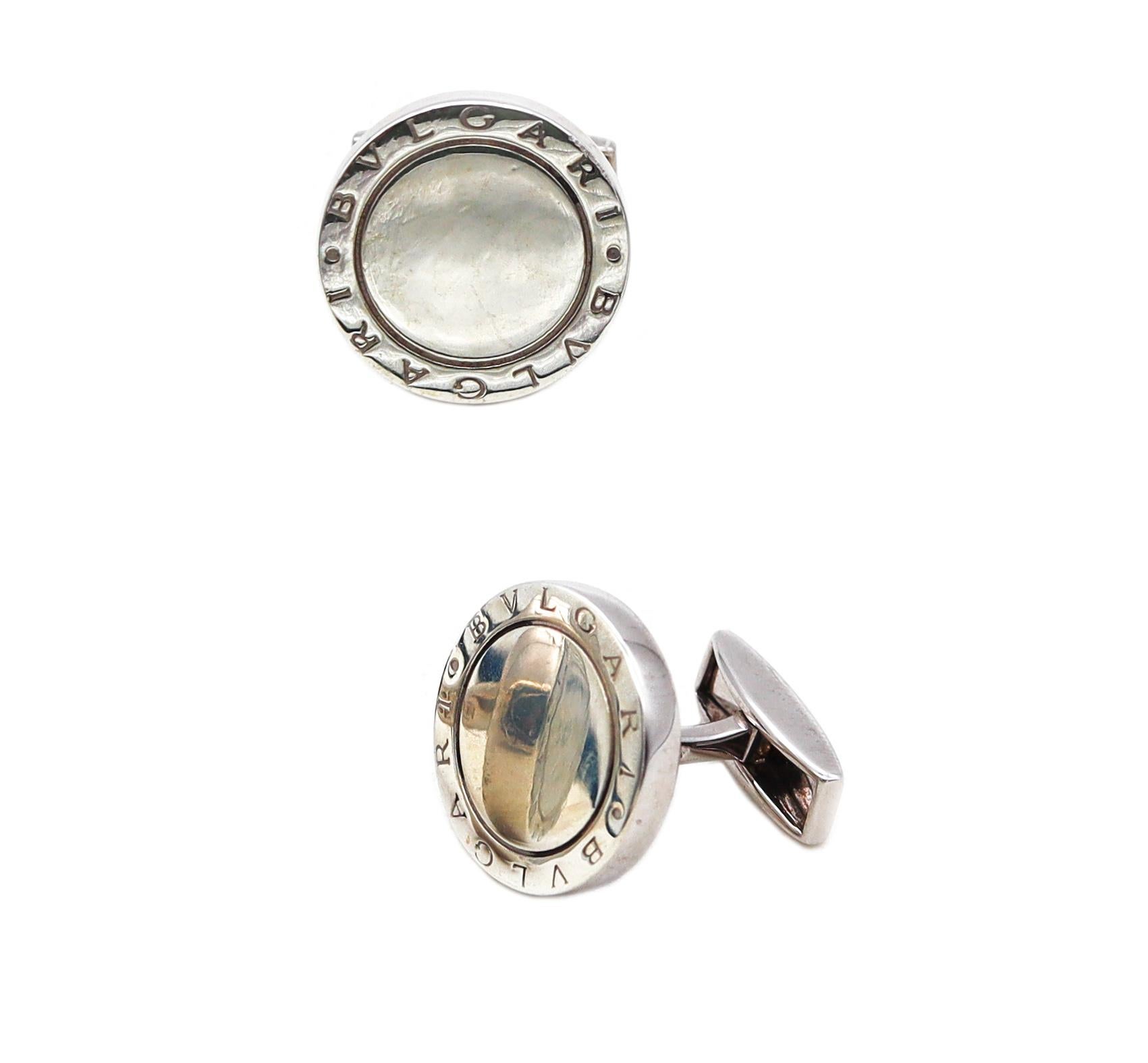 Pair of round cufflinks designed by Bvlgari.

Beautiful sleek pieces, made in Rome Italy by the house of Bvlgari. These elegant round cufflinks has been crafted in solid .925/.999 sterling silver featuring the double name of Bvlgari and suited with