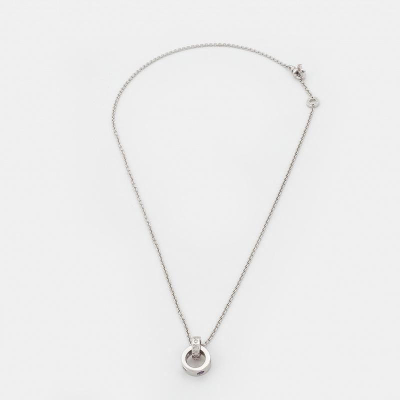 This radiant Bvlgari Bvlgari necklace is a timeless piece that will be cherished for years to come! It has been crafted from 18K white gold and features a stunning round pendant of two rings — one engraved with the brand name and the other set with