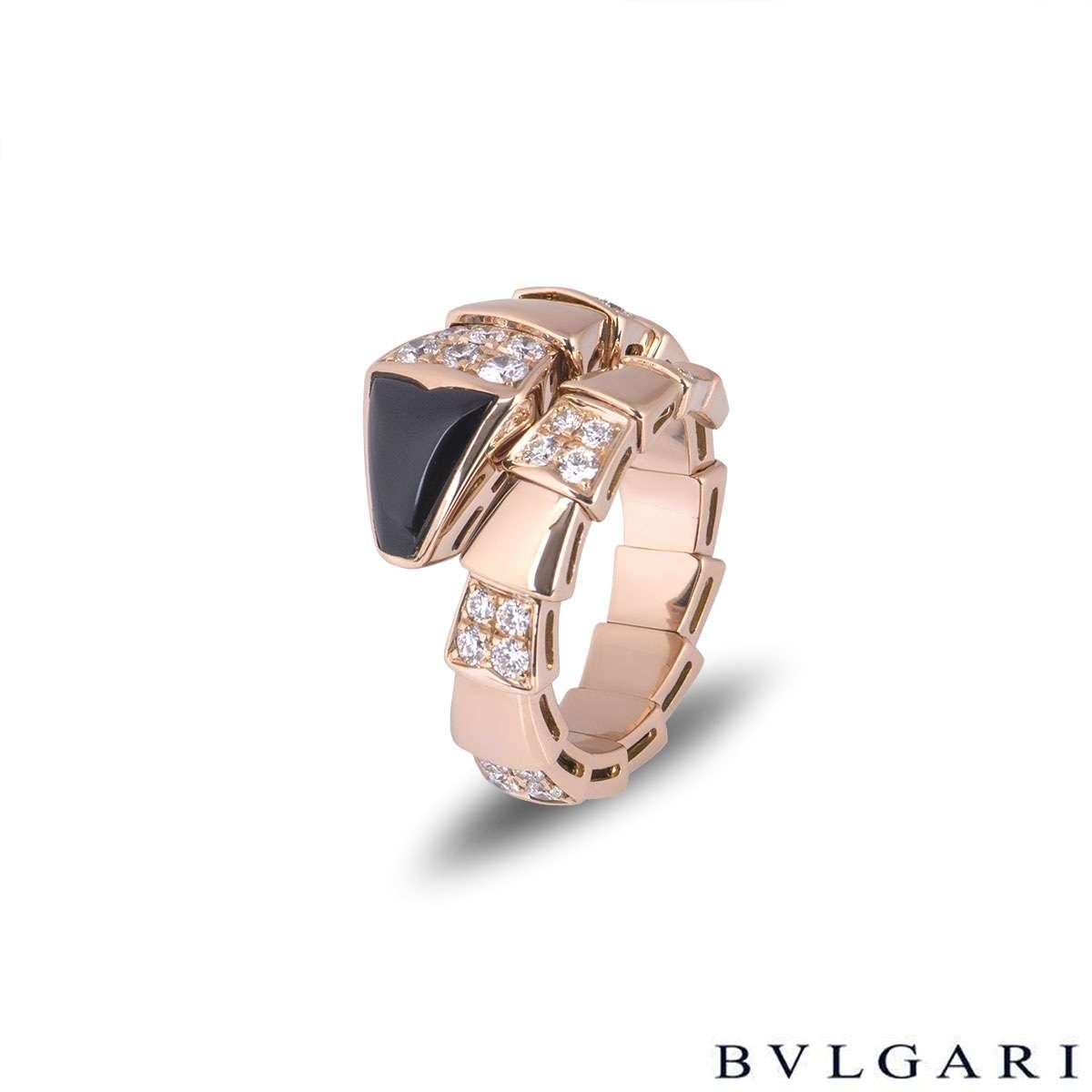 An 18k rose gold Bvlgari onyx and diamond ring from the Serpenti collection. The ring is in the form of a serpent wrapping around the finger with an onyx head and featuring alternating high polish flexible intersections and diamond set links. The