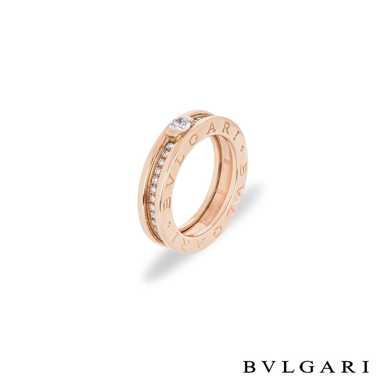 An 18k rose gold diamond Bvlgari ring from the B.Zero1 collection. Set to the centre of the ring is a 0.30ct round brilliant cut diamond in a tension setting, F in colour and VVS2 in clarity. Accentuating the centre stone are 40 round brilliant cut