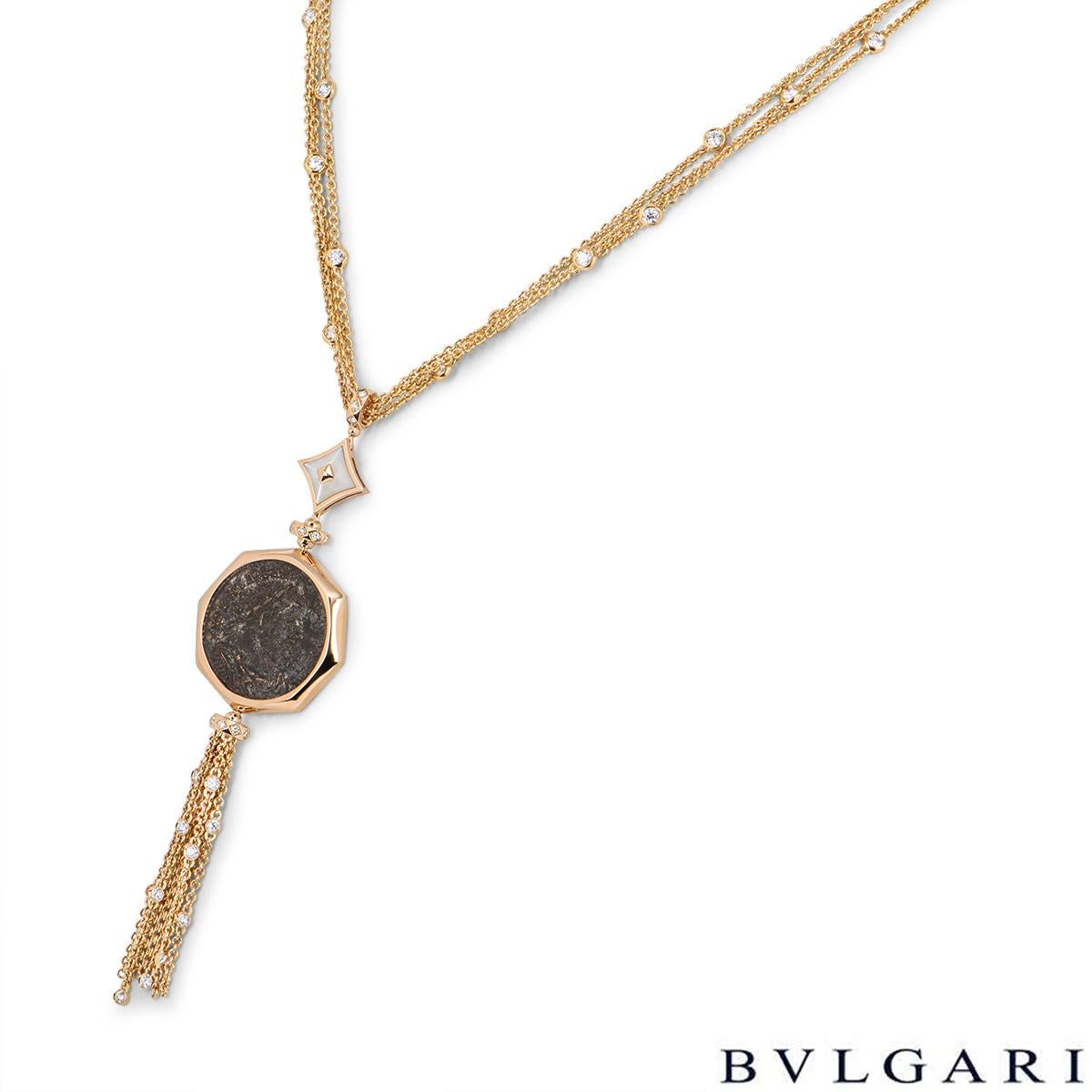 A stunning 18k rose gold Bvlgari necklace from the Monete collection 355982. The ancient coin is 2000 years old and set within a rose gold octagonal frame. Beneath and above the central coin are rose gold bails each set with 8 round brilliant cut