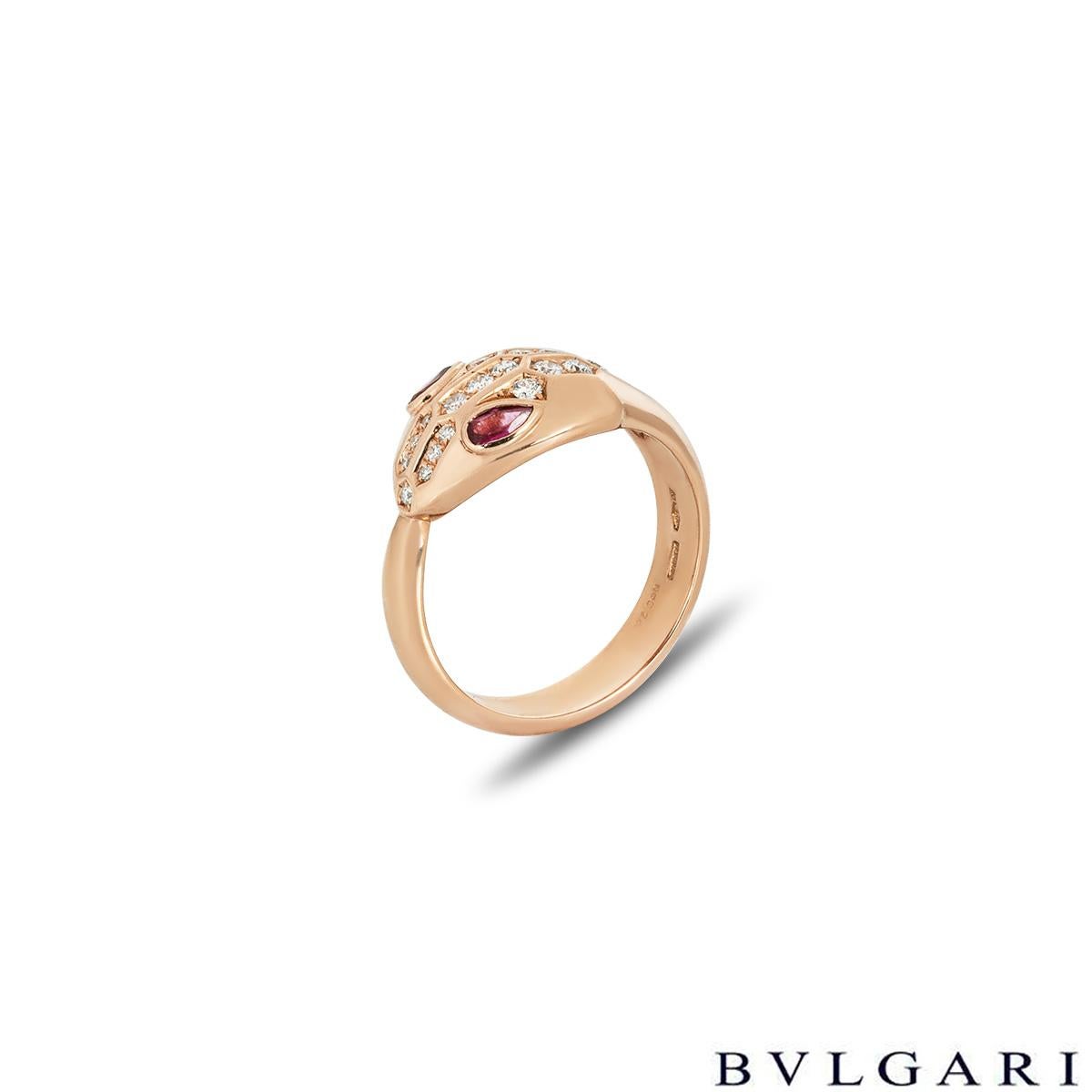 A stylish 18k rose gold diamond and rubellite ring by Bvlgari from the Serpenti Seduttori collection. The ring is composed of a snake design throughout with a diamond set head and rubellite eyes. The 18 round brilliant cut diamonds have an