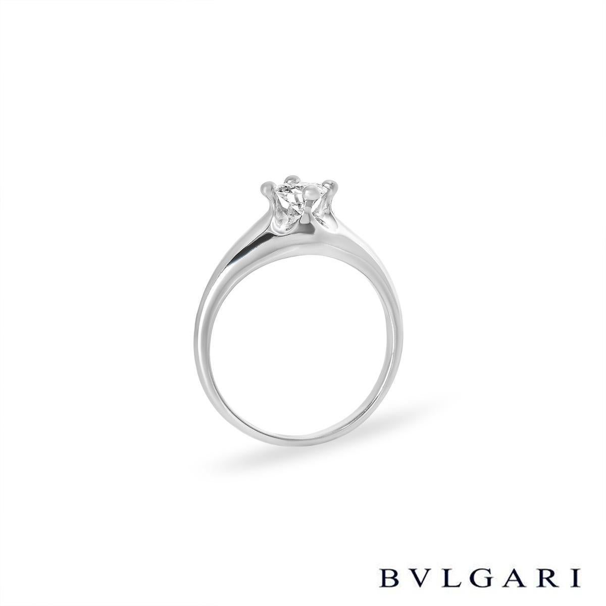 A stunning diamond single stone ring in platinum by Bvlgari. The ring is set to the centre with an approximately 0.35ct round brilliant cut diamond in a raised four claw compass setting, G in colour and VVS2 in clarity. The tapered 6mm ring is