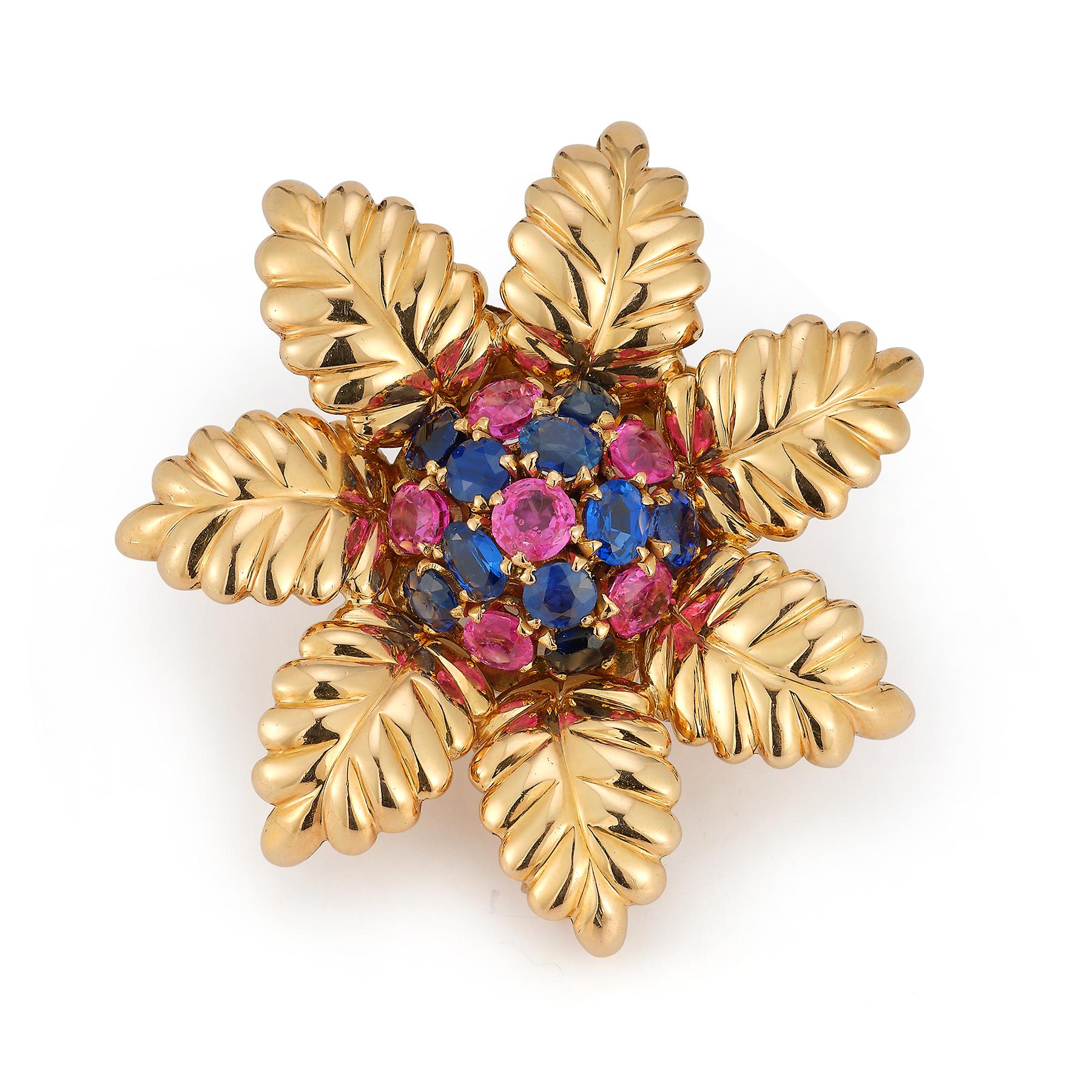 Bulgari Ruby & Sapphire Flower Brooch

Round cut sapphires & rubies forming a cluster & set in 18k yellow gold along with carved gold petals surrounding.

Measurements: 1.75
