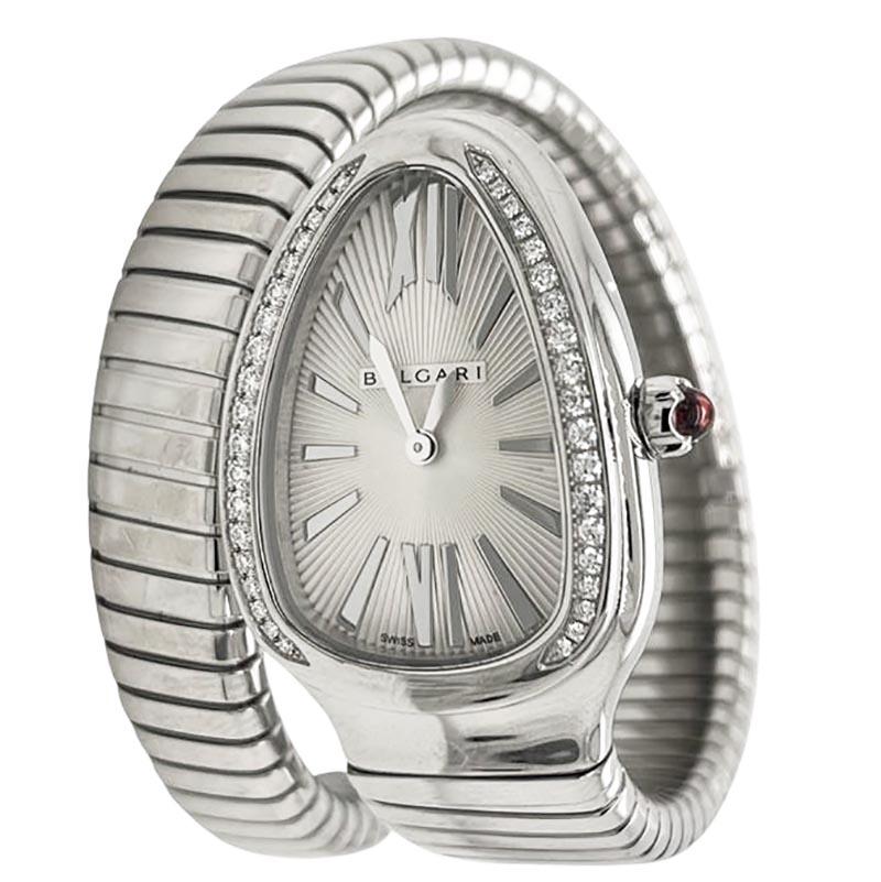 Brand: Bvlgari

Collection: Serpenti

Movement: Quartz

Case Size: 35 mm

Case Material: Stainless Steel

Bezel: Diamonds

Indices: Stick

Bracelet: Stainless Steel Tubogas

Features: Cabochon Pink Sapphire on crown

Includes: Brilliance Jewels 2