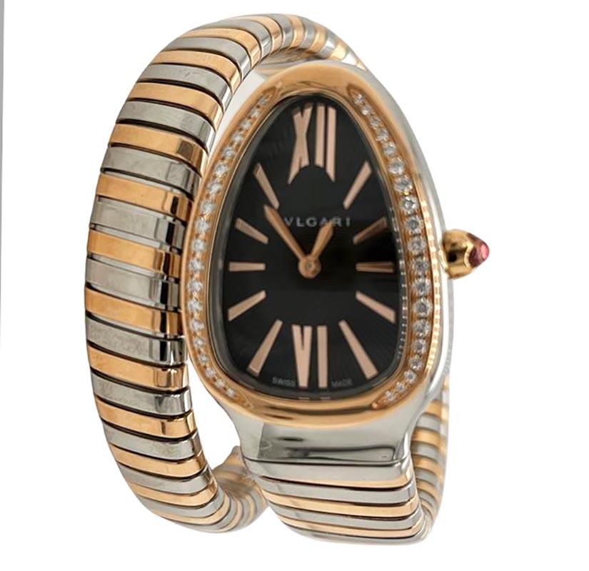 Designer: Bvlgari

Collection: Serpenti Tubogas

Style: Double Bracelet Wrap 

Model Number: 102681

Material: Rose Gold & Stainless Steel

Bezel: Diamonds on Rose Gold

Dial: Black Guilloche

Functions: Hours and Minutes

Water Resistance: 30