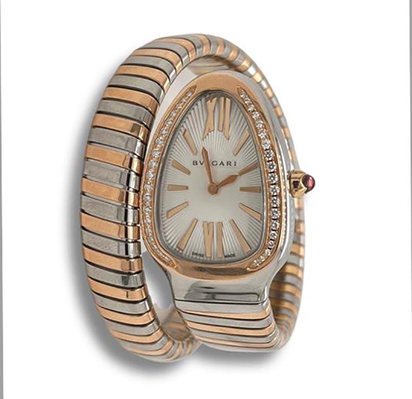 Designer: Bvlgari

Collection: Serpenti Tubogas

Style: Double Bracelet Wrap 

Model Number: 102237

Material: Rose Gold & Stainless Steel

Bezel: Diamonds on Rose Gold

Dial: White Guilloche

Functions: Hours and Minutes

Water Resistance: 30
