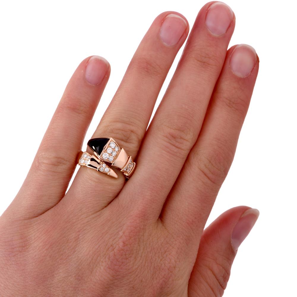 A Bvlgari Serpenti ring crafted in 18K pink gold with onyx inlays and 24 round diamond accents. Approx. 1.00 carats E-F color VS1 in stock in like new condition. Current Retail Price is $9700.00. This Bulgari ring is in exceptional condition offered