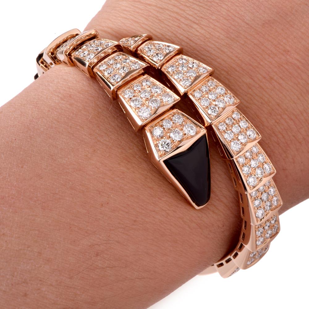 This elegant Snake diamond bracelet by Bvlgari takes an opulent serpentine shape. It’s designed in the form of a slithering serpent that curls around your wrist gracefully. It made of 18K rose gold, set all the with diamonds all around with