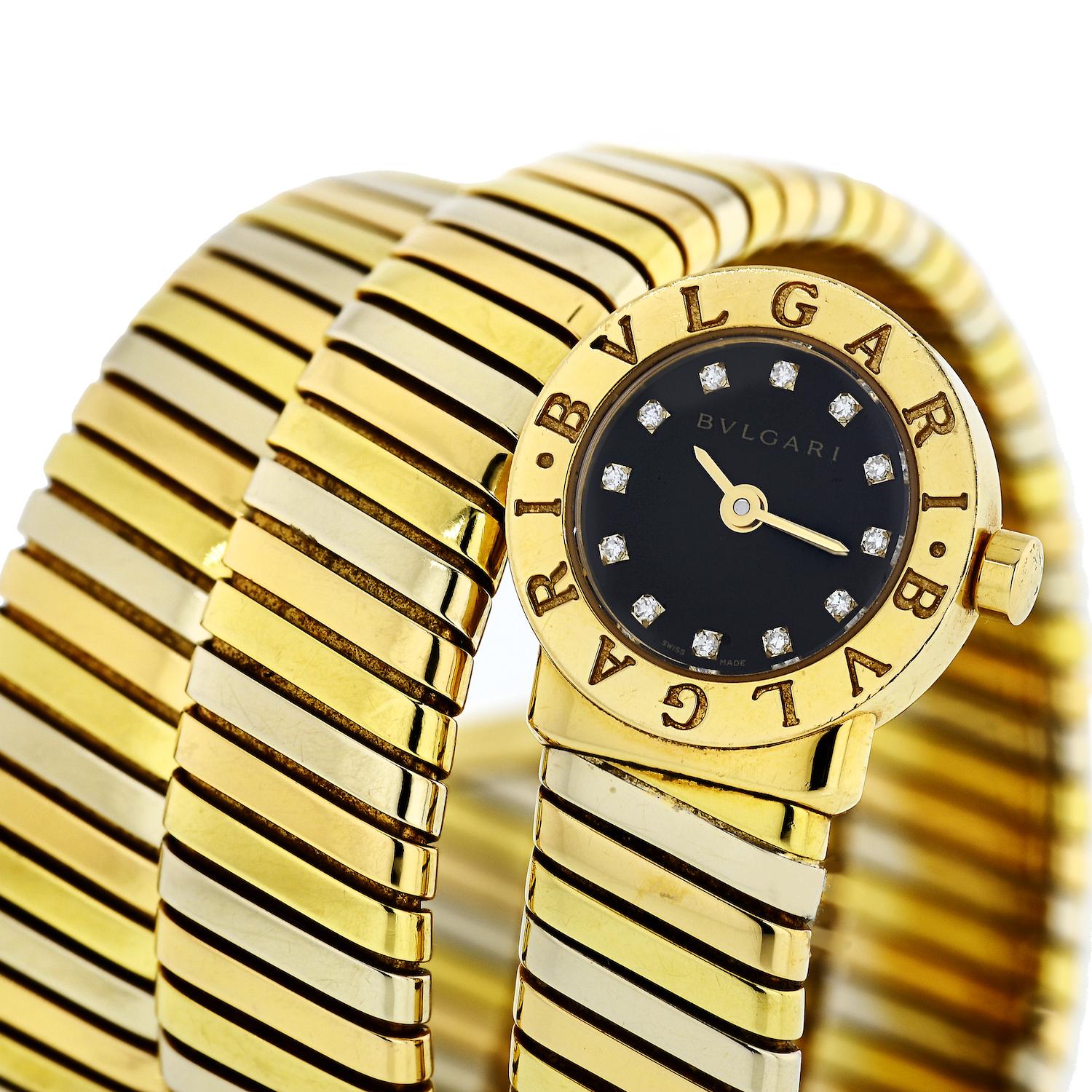 Stunning 18K Yellow Gold Serpenti watch by Bvlgari. With diamond hour markers. 
10 Round Cuts.
Black Dial.
Working condition.