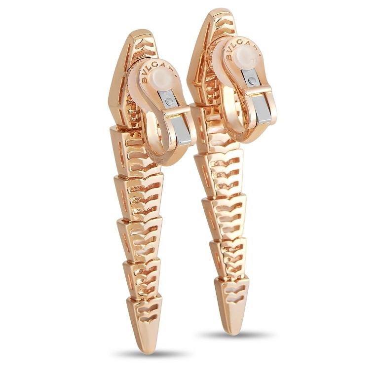 These Bvlgari Serpenti 18K Rose Gold Diamond Mother of Pearl Earrings were designed to be serpent-like in appearance. Each features a segmented body made from 18K Rose Gold and set with soft white Mother of Pearl inlays and diamonds on alternating