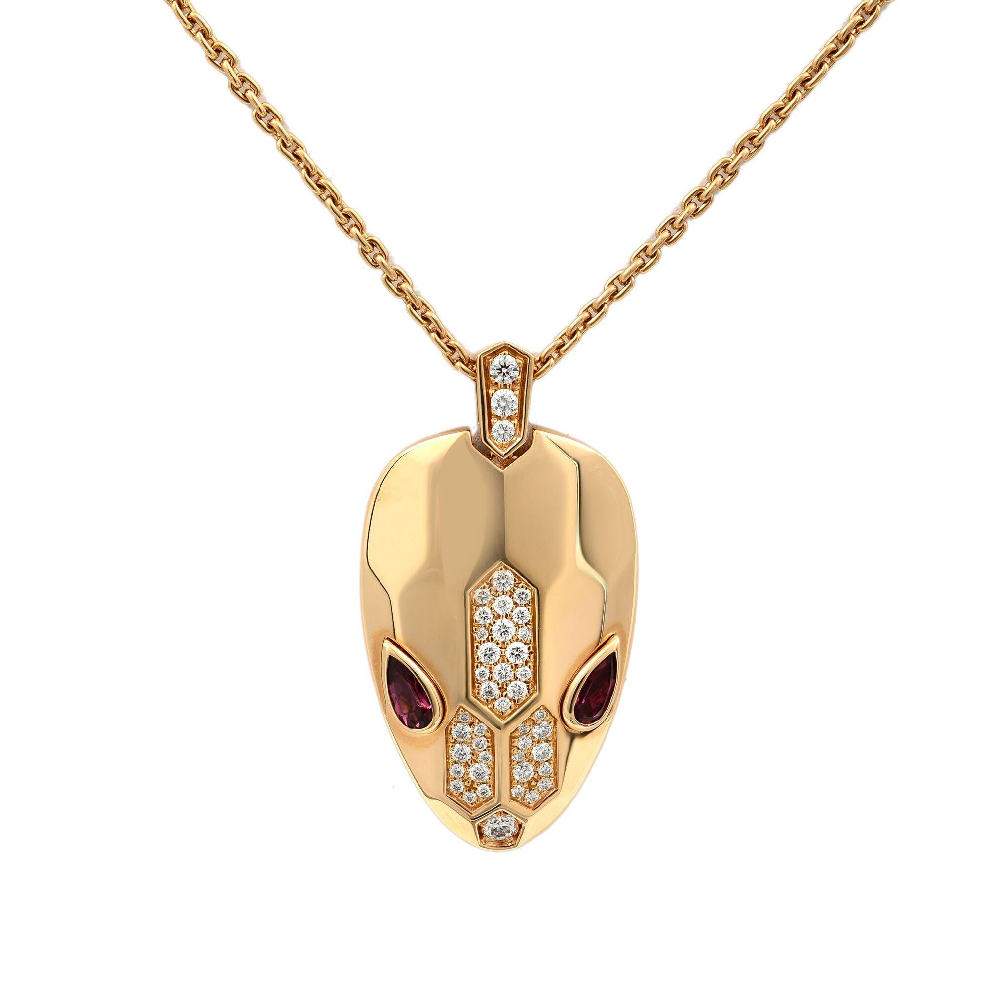 This is an amazing luxury Bvlgari Serpenti necklace with 18 kt rose gold chain and pendant, set with rubellite eyes and demi round cut pavé diamonds.Capturing the power of attraction, the Serpenti necklace glorifies the head of the snake in a