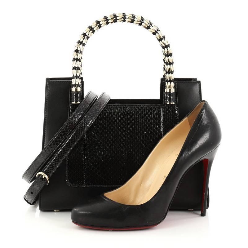 This authentic Bvlgari Serpenti Convertible Tote Leather and Python Small is a gorgeous bag perfect for the most sophisticated fashionista. Crafted in black leather and genuine python skin, this bag features dual enamel scaled handles, detachable