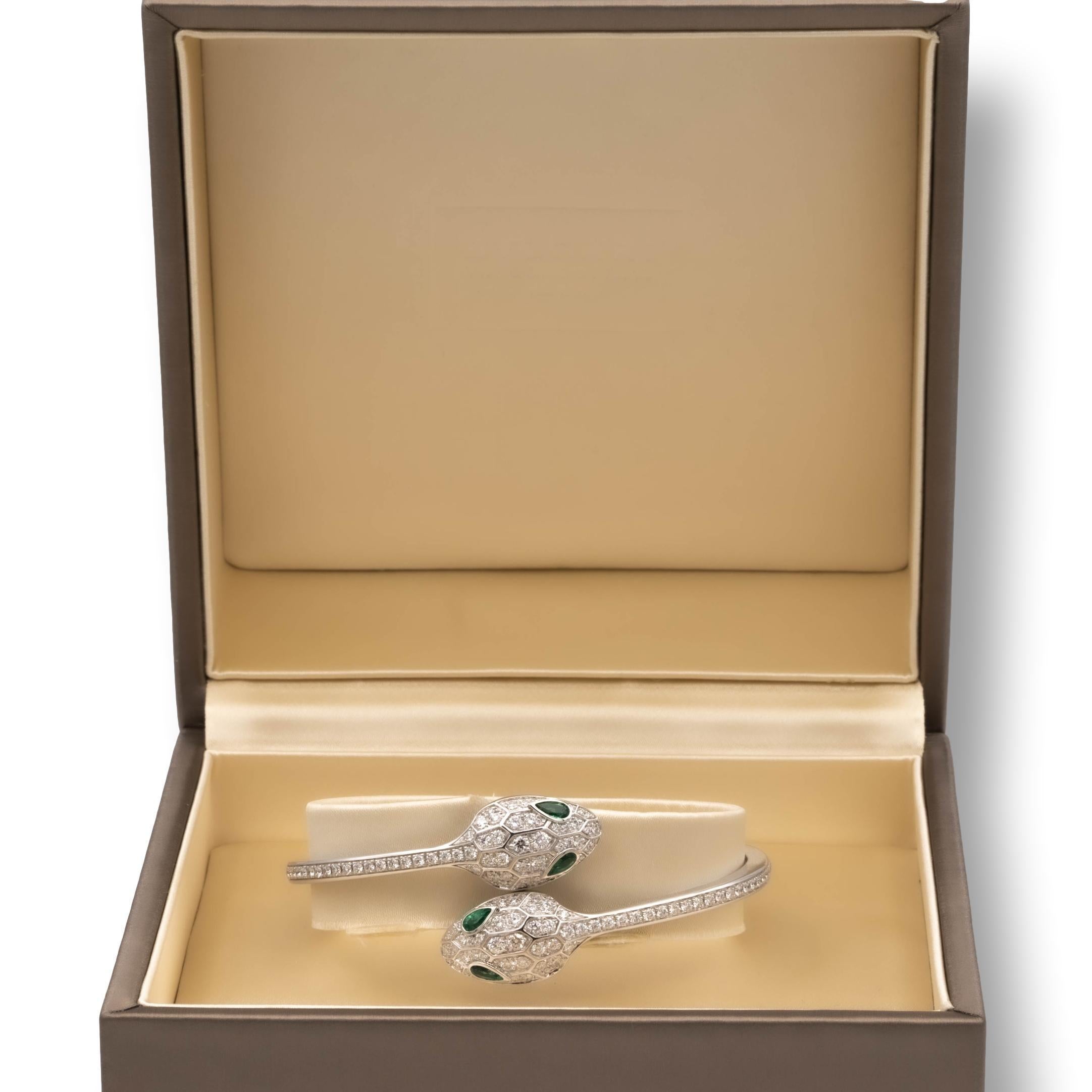 Bvlgari Serpenti bangle bracelet finely crafted in 18 karat white gold with pave set round brilliant cut diamonds weighing 1.66 carats total weight. Fine E-F color VVS clarity.
This iconic bracelet features a double face snake head on either side