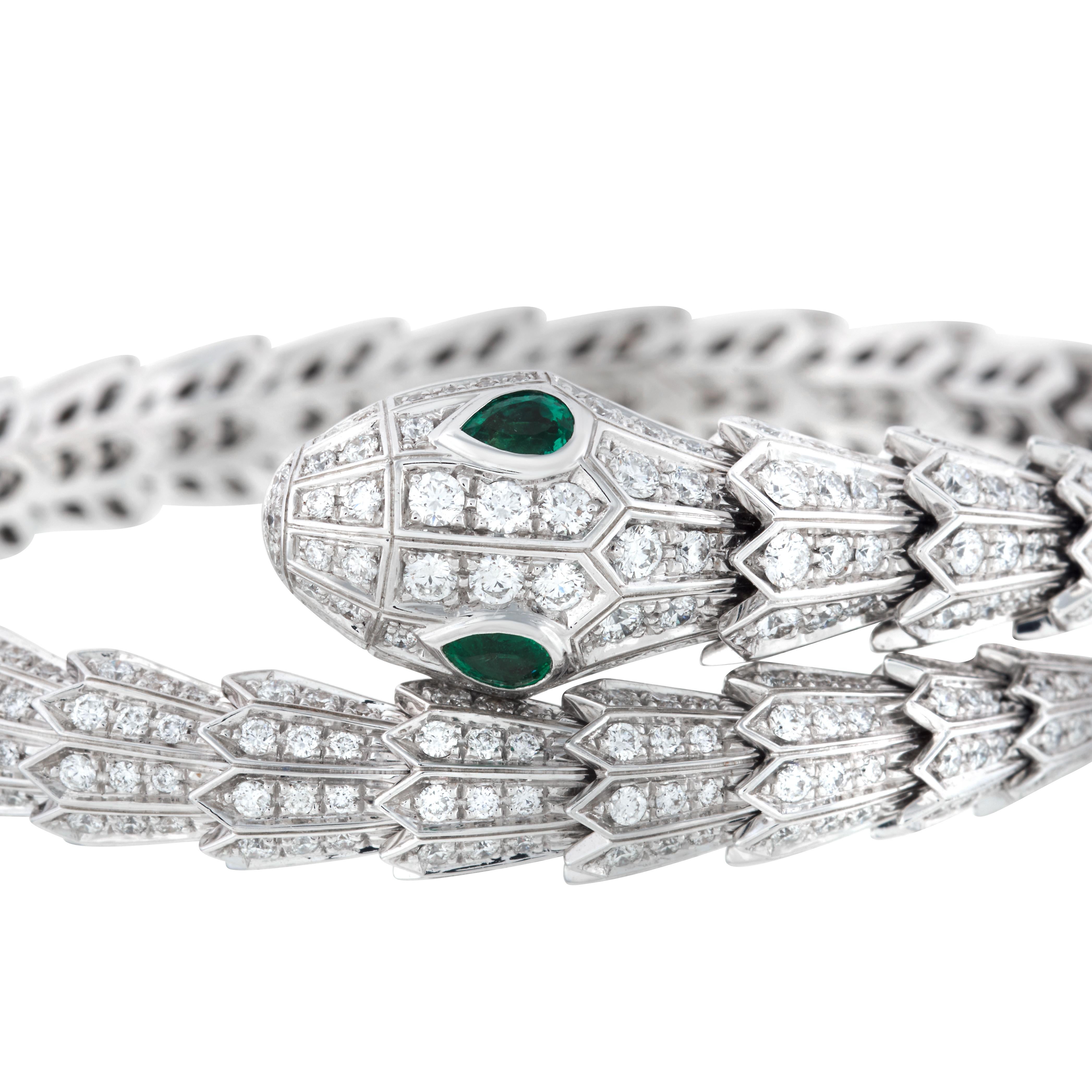 Bulgari Serpenti diamond snake bangle bracelet with emerald eyes in 18k white gold, accompanied by Bulgari box and Bulgari certificate of authenticity.

This bracelet contains 592 round diamonds totaling approximately 4.33 carats, and is accented