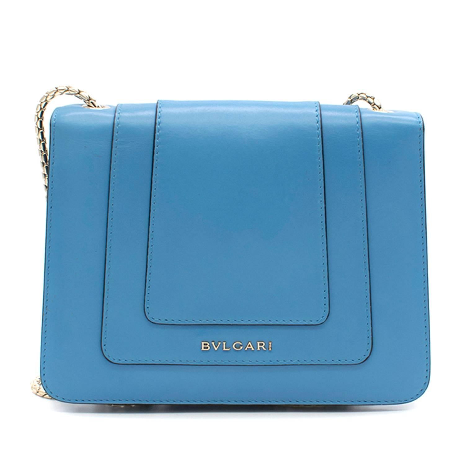 Bvlgari 'Serpenti Forever' Blue Flap Cover Bag.
Made in Italy. 
Current Season. 

Features signature Bvlgari logo on the back of the bag. 
Brass light gold plated snake head closure in black and white enamel with eyes in green malachite. 
Small size