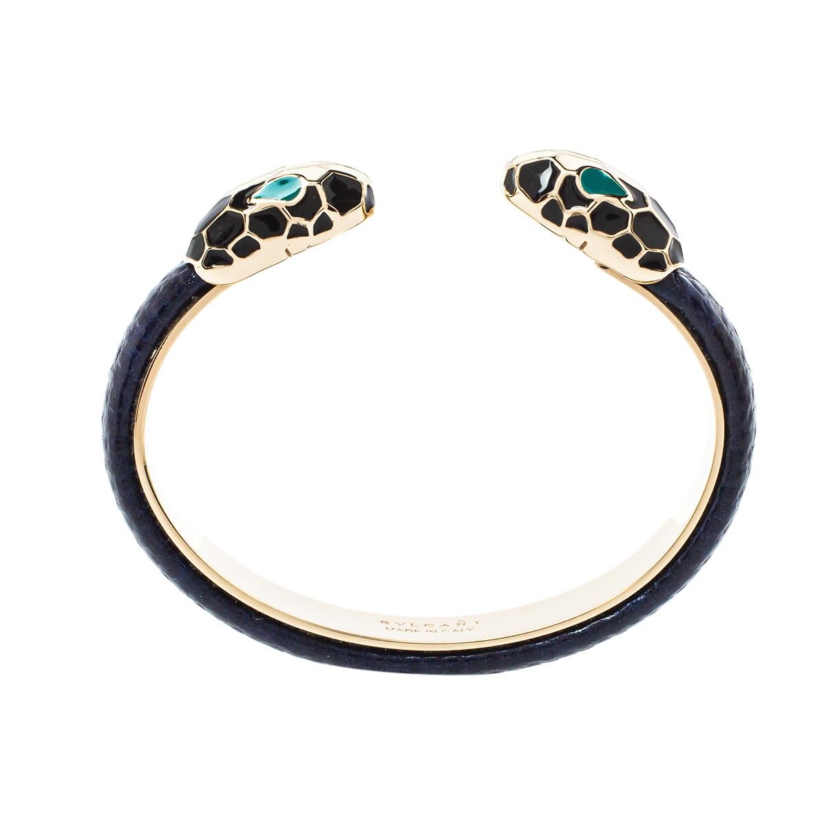 Created using gold-plated metal and karung leather, this Bvlgari Serpenti Forever open cuff bracelet is highlighted with Serpenti heads on its ends. It's a signature Bvlgari style that you'll love wearing.

Includes: Branded Pouch