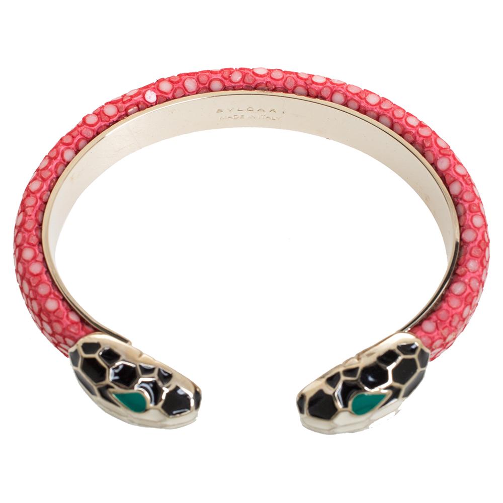 Exuding glamour and classic style, this bracelet from Bvlgari is a gold-plated metal creation that is enhanced with galuchat leather and the brand's iconic Serpenti head motifs adorned with enamel. This open cuff style bracelet is so pretty you'll