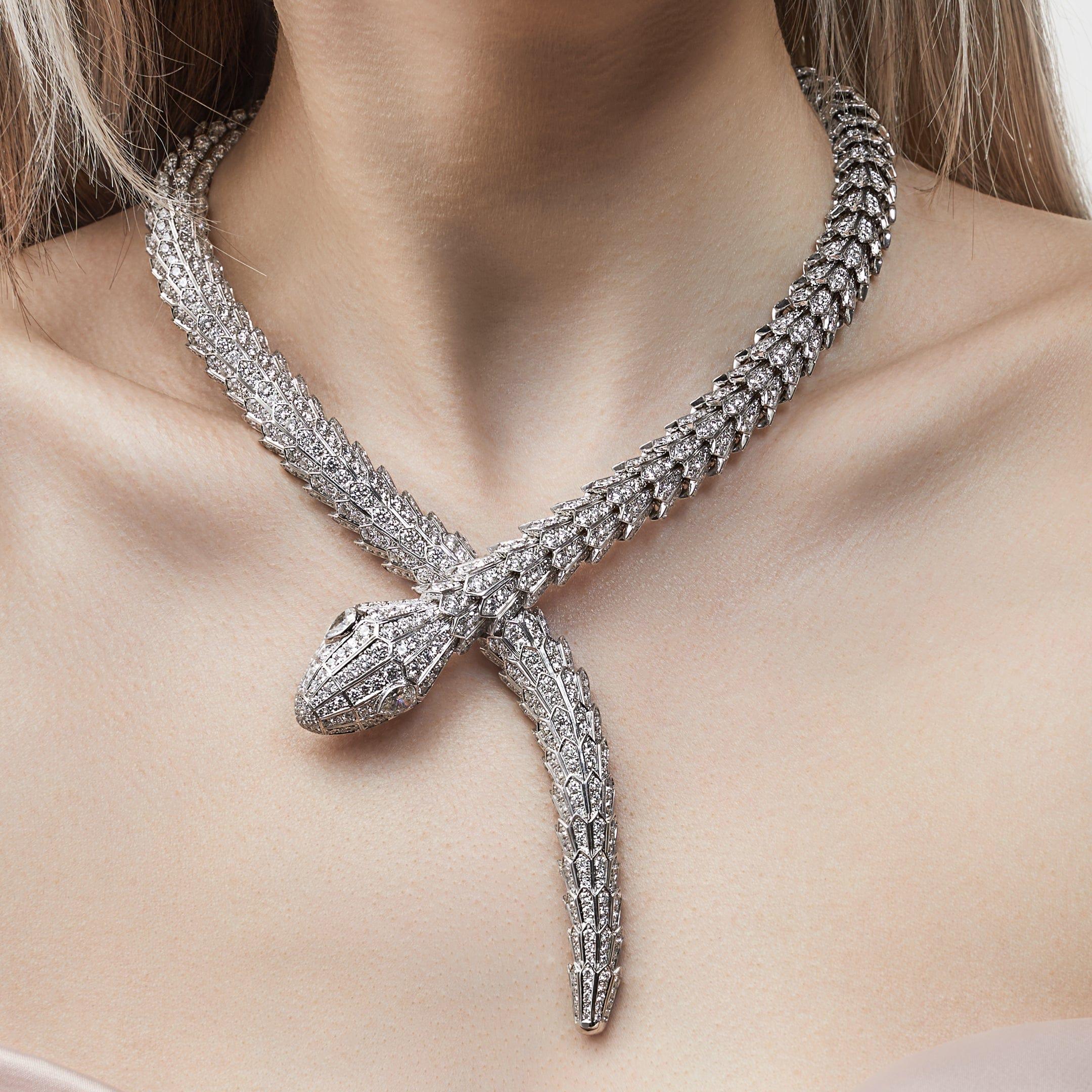 Crafted from 18-karat white gold, this Bvlgari Serpenti necklace is a symbol of Bulgari's artistry and innovation.  Featuring pavé-set diamonds , the head and tail of the serpent mimic the snake's scales and add elegant brilliance to the piece. 

A
