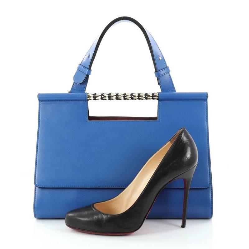 This authentic Bvlgari Serpenti Scaglie Day Bag Leather is a gorgeous bag perfect for the most sophisticated fashionista. Crafted in blue and plum leather, this bag features an enamel scaled bar handle, a leather top handle, structured silhouette,