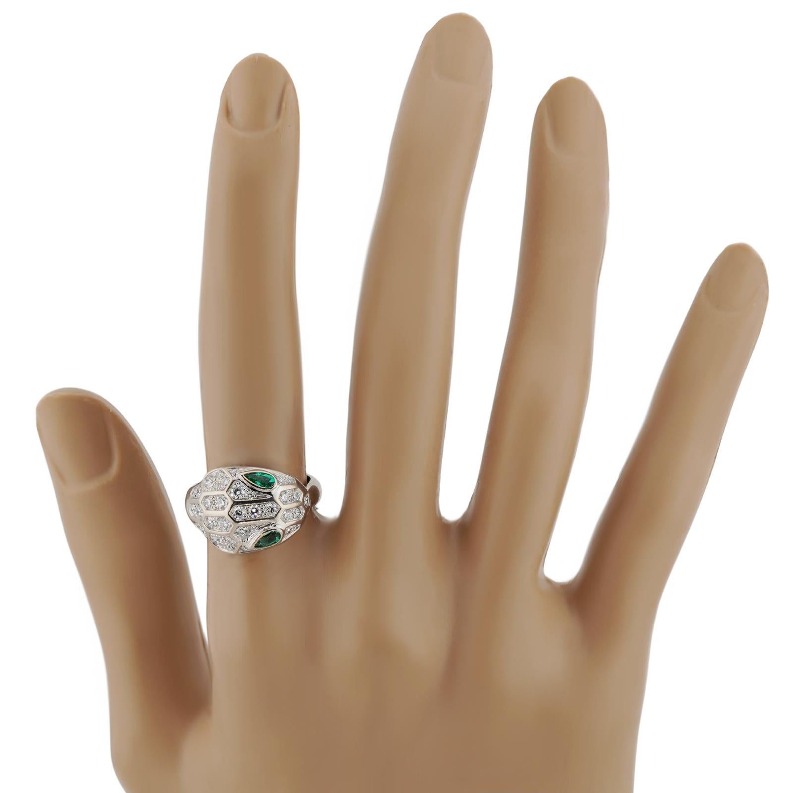 This exquisite authentic Bvlgari ring from the iconic Serpenti Seduttori collection is crafted in 18k white gold and set with a pair of pear-cut green emeralds and round brilliant E-F-G VVS2-VS1 diamonds. Made in Italy circa 2020s. Measurements: