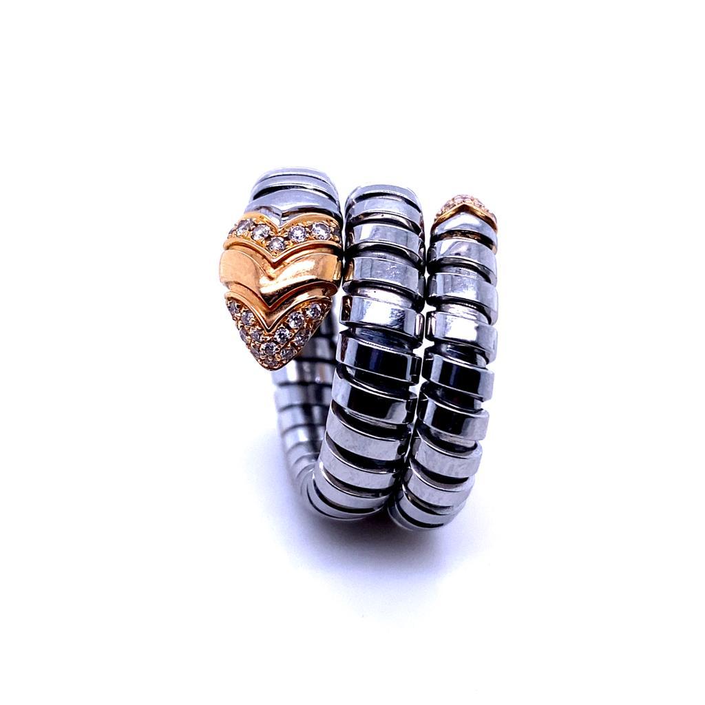 A Bvlgari Serpenti Tubogas 18 karat rose gold steel diamond ring

Blending two of Bvlgari's signature collections together this piece combines Serpenti and Tubogas.
Designed as the fluid shape of a serpent the stainless steel coil wraps around the
