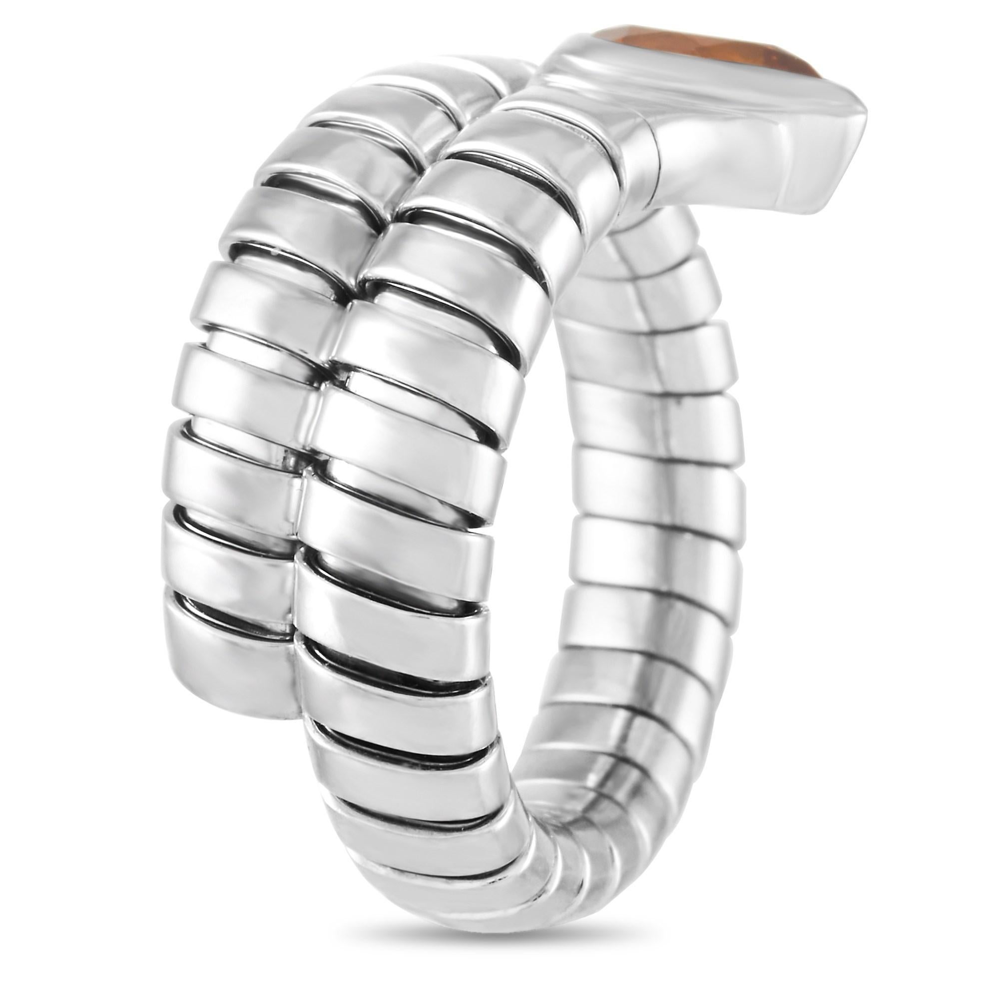 This unique ring from the Serpenti Tubogas collection from Bvlgari is made with 18K White gold and wraps around the finger. The band has striations throughout and is set with a lovely pear cut Citrine, which the band conforms around, giving it a