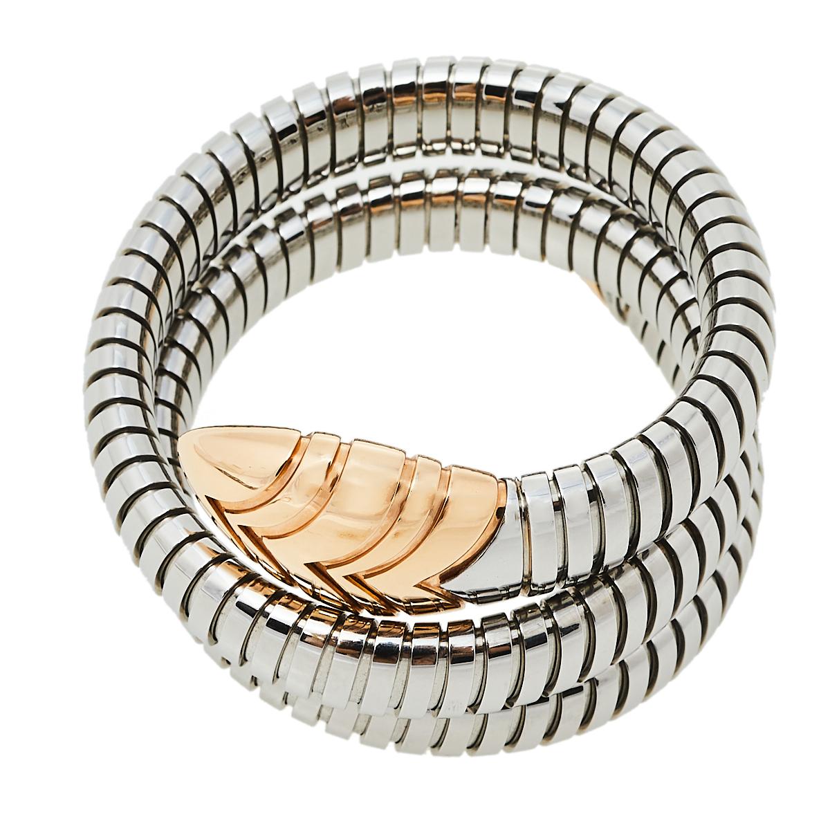 Exuding glamour and unique style, the bracelet is a melange of Bvlgari's two most iconic designs, the Serpenti and Tubogas. The stainless steel body, spiraled thrice, featuring the fine lines of Tubogas technique, represents the sensual curves of a